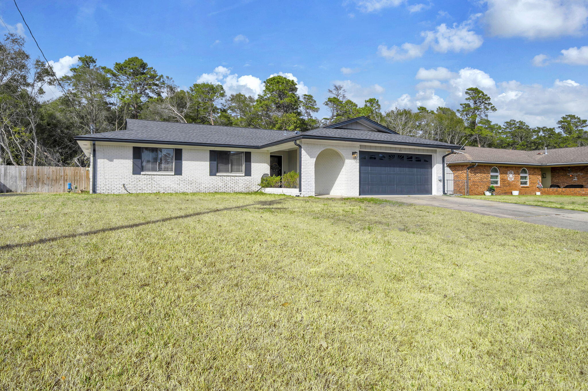 Welcome to this beautifully maintained 3-bedroom, 2-bathroom home, offering 1707 sqft of comfortable living space. The exterior has been painted, giving the home fresh curb appeal. Inside, you'll find an updated kitchen featuring stunning granite countertops, ample cabinet space, stainless steel appliances, and a breakfast nook that could be used as an office. In addition, the home features a separate laundry room, a primary walk-in closet, and updated bathrooms. The roof was installed in 2022, offering peace of mind for years to come. Located just a short, convenient commute to both Eglin and Hurlburt AFB,this home is perfectl