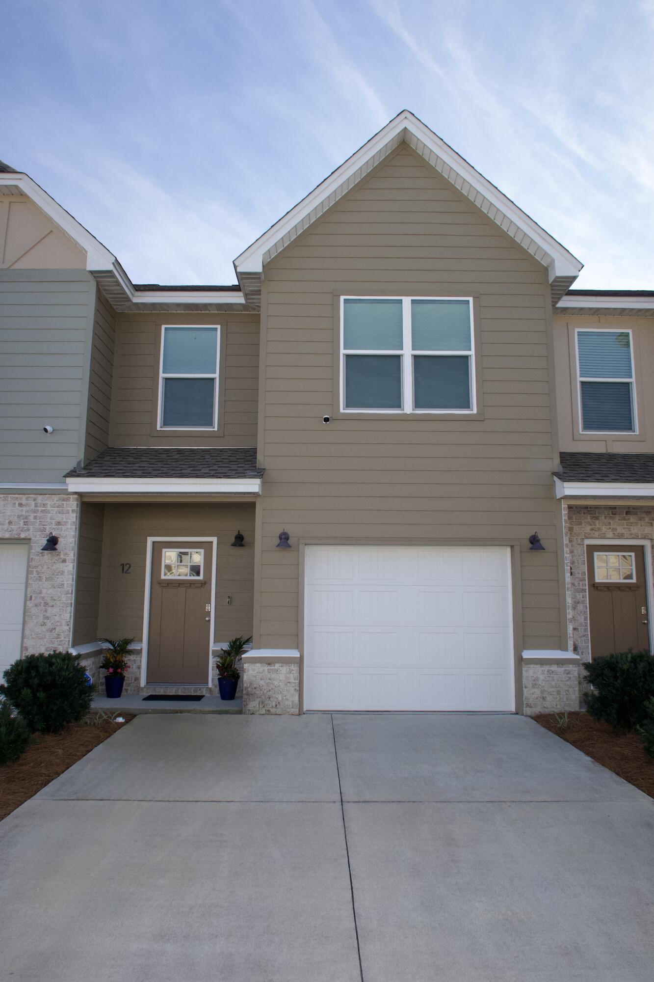 Welcome to this beautifully maintained 3BR/2.5BA townhome, perfectly positioned in Tuscan Village, which offers the perfect blend of comfort and convenience. Ideally located just behind Big Kahuna's Waterpark and minutes from the Emerald Coast's white-sand beaches, shopping, dining, and Destin Harbor. Inside, enjoy luxury vinyl plank flooring, granite countertops throughout, stainless steel appliances, and an open-concept living area that flows to a private back patio. All bedrooms are upstairs for added privacy, including a spacious primary suite. Complete with a one-car garage and rear double parking pad, this move-in-ready home delivers location, style, and functionality in one exceptional package.