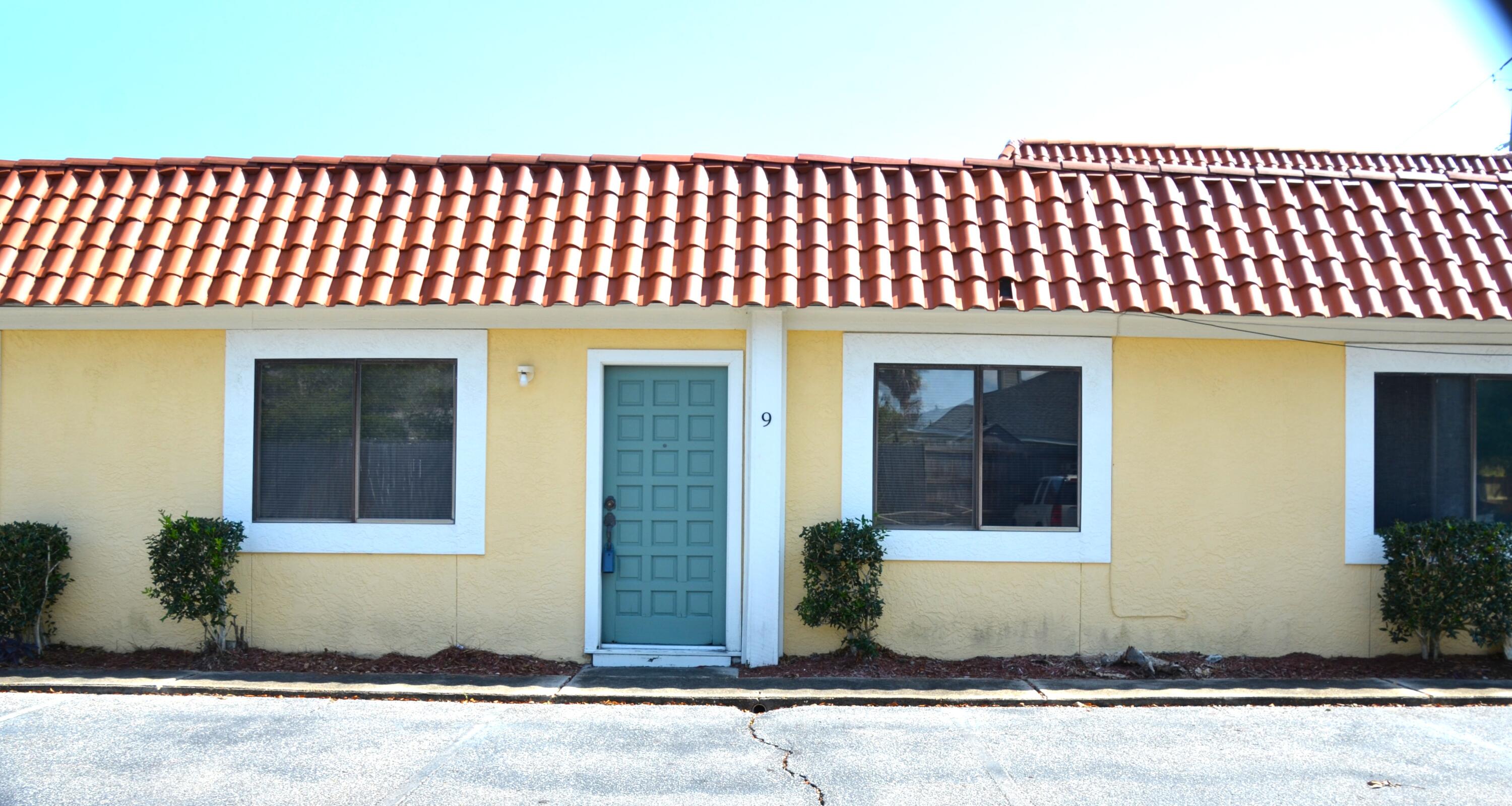 This unit boasts six separate offices plus a bathroom and a file niche.   The unit is one of two that are located in the rear of the plaza which gives it a peaceful atmosphere away from road noise.  It is currently being used by a painter to spray cabinets, but you can easily visualize that this was once high-end office space.   The building is in favorable Flood Zone X.