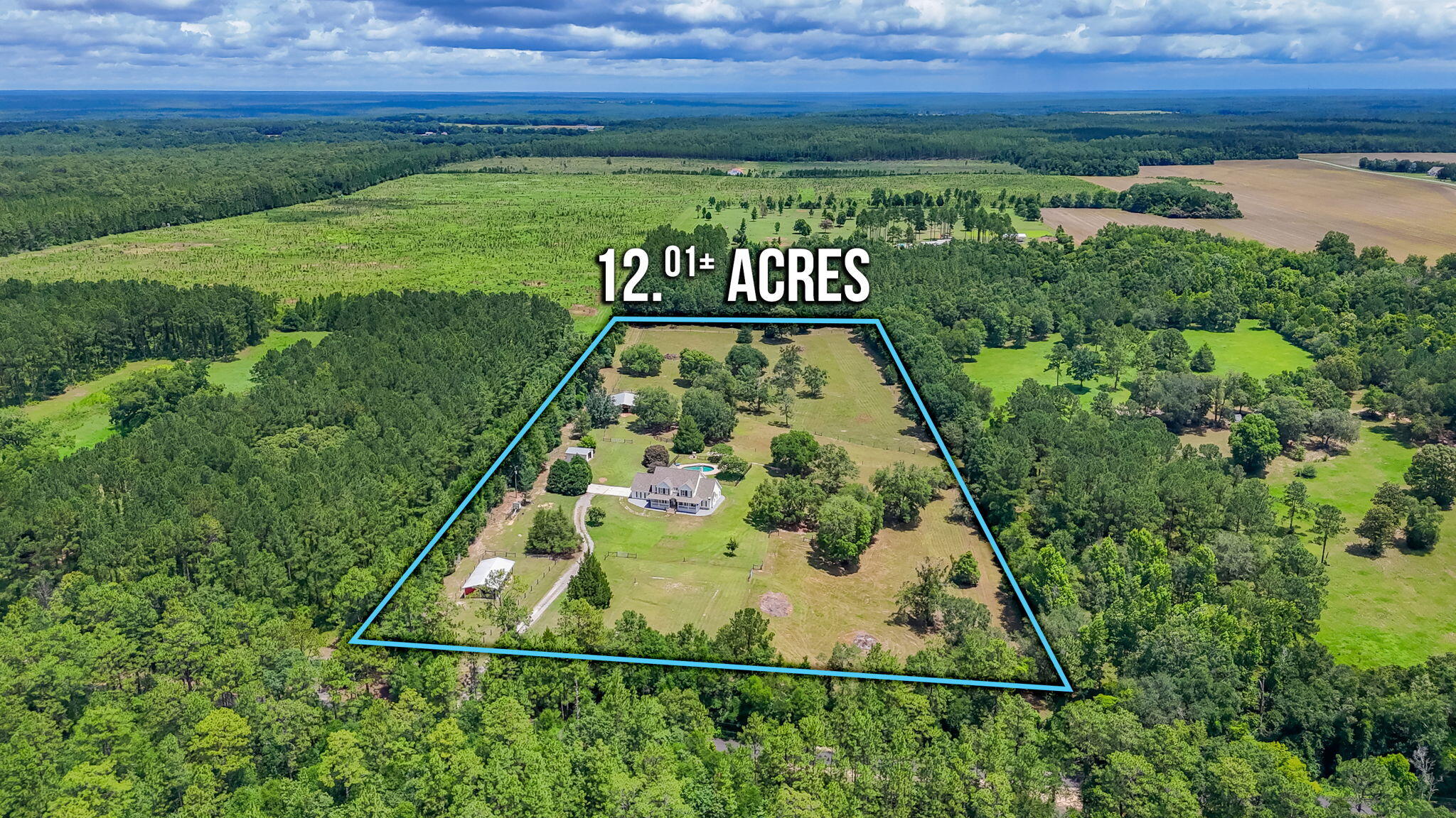 Calling All Equestrian Enthusiasts! Nestled on  12 private acres and next to the Blackwater River State Forest, this exceptional property offers the perfect blend of peaceful country living, functionality, and room to roam--just bring your horses, cattle, goats, donkeys!
Spanning over 4,100 square feet, this custom-built home features 4 bedrooms, 3.5 bathrooms, multiple living areas, and a versatile floor plan designed for a variety of lifestyles. The main level showcases hardwood floors, formal living and dining spaces, a spacious family room with a fireplace, and a well-appointed kitchen with abundant cabinetry, bar seating, and a bright breakfast nook overlooking the property. The first-floor primary suite includes a large ensuite bath with a garden tub and separate shower.
Upstairs, you'll find three additional bedrooms, two office/study areas, and a large bonus room perfect for a media room, playroom, or flex space. A tiled Florida room provides additional space to relax and enjoy the scenic surroundings.
 Featuring  a 60x48 barn with 7 stalls, tack room, and storage; a 24x48 guest barn with 3 stalls and tack room; a dog kennel building with multiple runs; a 16x16 workshop with electricity; multiple pastures (4), corrals, and a training ring.
Enjoy a saltwater gunite pool, expansive patio areas, and a covered back porch overlooking the property. Additional features include a 420' deep well, 2021 roof, upstairs HVAC (2023), downstairs HVAC 2026 water heater 2026.