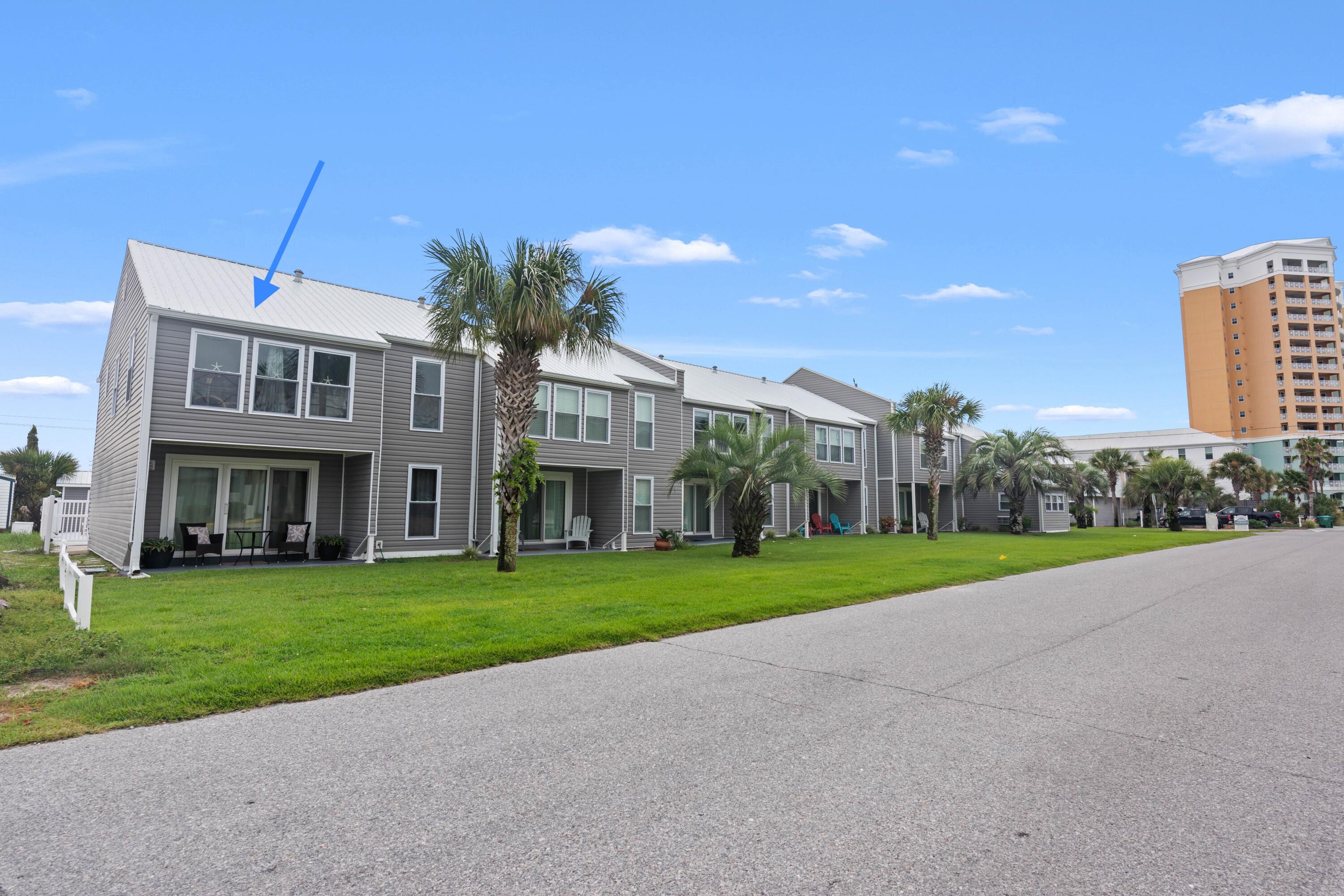 Updated top-floor end-unit condo in Panama City Beach, ideally located between the pool and beach in sought-after Lower Grand Lagoon. This low-density beachfront complex offers gated beach access to the sugar-white sands and emerald waters of the Gulf of Mexico just across the street--perfect for those seeking a Panama City Beach condo near the beach.

Flooded with natural light, this open-concept condo features wood-look tile flooring, sleek stone countertops, stainless steel appliances, and a brand-new 2023 HVAC system. The desirable end-unit location provides extra windows and a bright, airy atmosphere, making this property feel like a true coastal retreat.

Designed with both comfort and investment potential in mind, the added bunk room boosts short-term rental income opportunities. A spacious storage closet can easily be converted into an owner's closet, ideal for vacation rental owners. Rare attic storage space provides additional room for beach gear, bikes, and seasonal items--an uncommon and valuable feature in Panama City Beach condos.

Located just minutes from St. Andrews State Park, marinas, waterfront dining, shopping, and local attractions, this condo offers the best of coastal living. Whether you're searching for a vacation home, investment property, or full-time residence, this Panama City Beach condo for sale delivers location, lifestyle, and income potential.