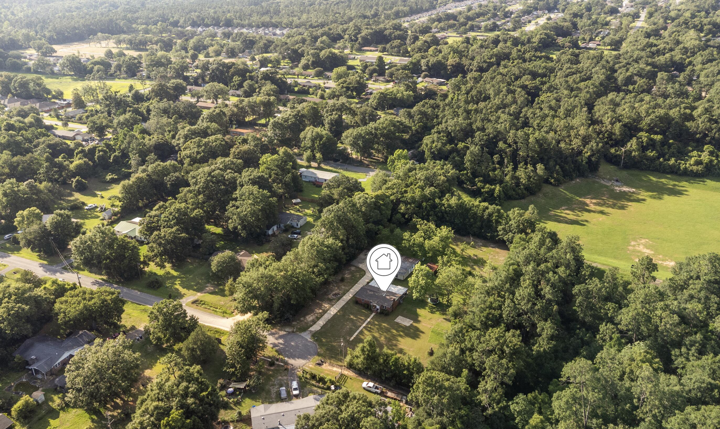 Welcome to your private slice of paradise! Nestled on over 2 acres at the end of a peaceful cul-de-sac, this beautifully updated home offers the perfect blend of comfort, privacy, and country charm. Surrounded by nature and fresh air, this property is ideal for those who are looking for space to grow, play, and create lasting memories.
The home has been freshly painted and features a remodeled laundry room, kitchen with beautiful black appliances, upgraded bathrooms, bedroom and meticulous maintenance throughout. The enclosed Florida room provides additional living space with its own window A/C unit and includes a brand-new hot tub, creating the perfect place to relax year-round. The expansive lot is home to 24 mature pecan trees that are already blooming, offering both beauty and seasonal harvests. Two versatile large sheds, each equipped with its own window A/C unit, provide endless possibilities for workshops, hobbies, guest space, a home office, or storage. One shed even includes a water connection and refrigerator for added convenience and ample carport. The property is enclosed with metal fencing along the sides and rear. 
Additional highlights include a large paved parking area with room for more than five vehicles, making it easy to accommodate guests, boats, trailers, or multiple family cars.
If you've been searching for a move-in ready home that offers peace, privacy, nature, and room to enjoy life, this exceptional property is a must-see.