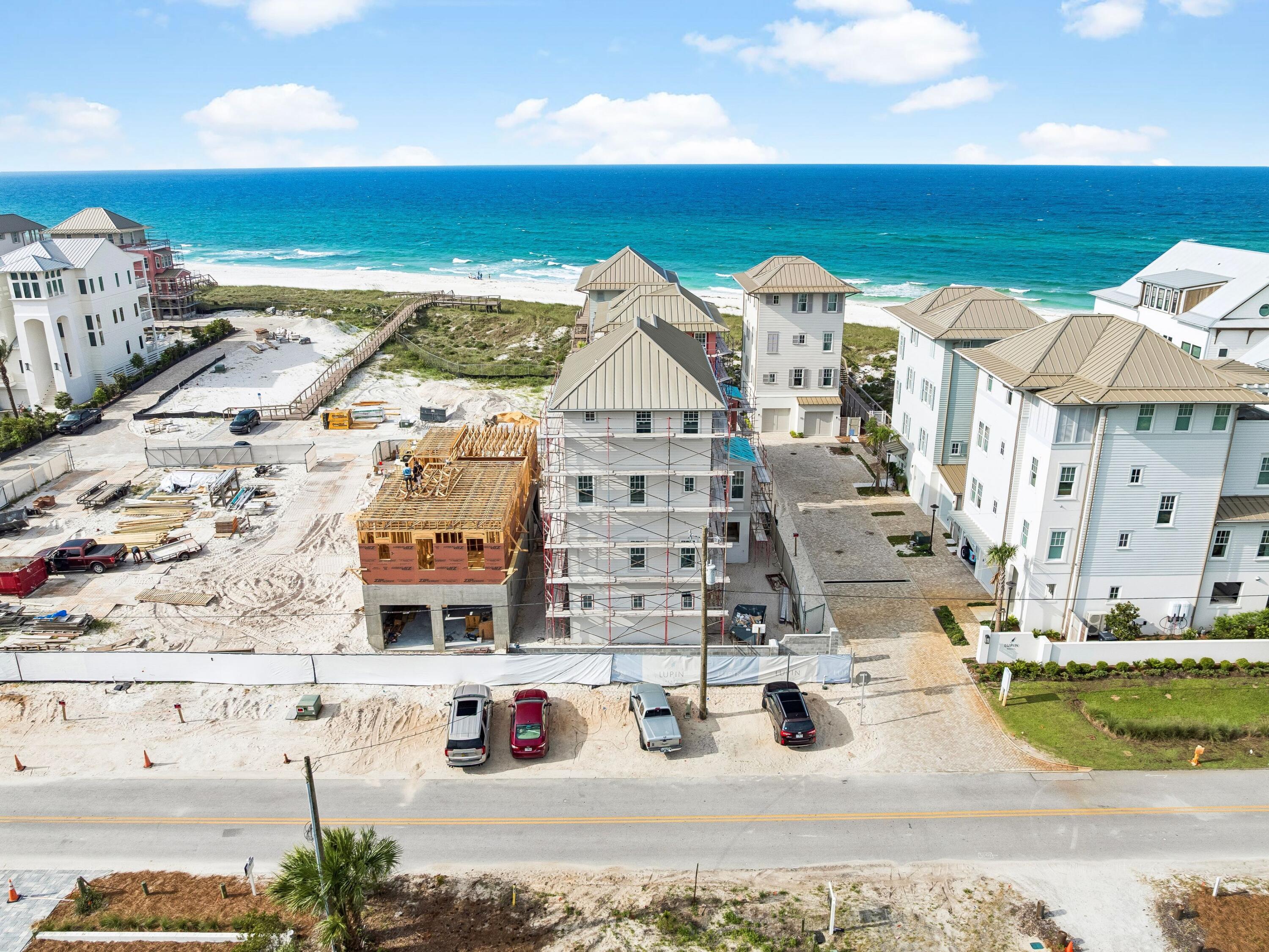 Tucked within the intimate, architecturally curated enclave of Lupin Beach, Lot 10 introduces a rare opportunity to experience the peaceful side of Inlet Beach--where elegant design, quiet surroundings, and thoughtful craftsmanship come together just moments from the most celebrated destinations along Scenic 30A. Designed by the esteemed team at Historical Concepts, this boutique Gulf-front community offers a refreshing alternative to the more dense locations of Rosemary and Alys Beach, while delivering effortless access to both. Spanning 3,110 square feet across four refined levels, the home is composed with a calming, sanctuary-like sensibility. Soft, creamy tones, warm neutral textures, and elevated detailing define its interiors, creating an atmosphere that feels serene, airy, and deeply restorative. Natural light moves gracefully through each level, enhancing a layout that blends generous gathering spaces with private areas for reprieve.

The home's defining architectural moment is the expansive top floor terrace, a breezy elevated retreat designed for quiet mornings, glowing sunsets, and intimate evenings above the coast. Paired with a family room and wet bar, this level serves as a private oasisideal for unwinding, entertaining, or simply savoring the rhythm of Gulf breezes.

Across its multiple floors, the residence offers extraordinary flexibility for full-time homeowners, second-home seekers, and multigenerational families alike. Two main living areas provide separation and comfort, while four bedrooms plus a bunk roomeach supported by full or half bathsensure ample accommodation for guests. An elevator serving all levels enhances accessibility and ease, making daily living both convenient and intuitive.

The ground floor is purpose-built for coastal life, featuring a covered outdoor living area, changing room, shower, and an oversized two-car garage,an ideal transition from beach days to home. Upper levels reveal refined living and dining spaces, a tranquil primary suite with private sitting area and terrace access, additional ensuite bedrooms, and thoughtful storage throughout.

Lot 10 also enjoys one of the most enviable locations along the eastern edge of 30A. Steps away, Lake Powell, one of Florida's most iconic coastal dune lakes, invites paddleboarding, kayaking, and quiet exploration. Immediately to the east, Camp Helen State Park offers preserved natural beauty, hiking trails, a fishing pier, and abundant wildlife. And within a short walk or bike ride, the world-class dining, boutiques, and cultural experiences of Rosemary Beach, Alys Beach, Seacrest, and Kaiya Beach Resort await.

For recreation and club amenities, owners benefit from close proximity to Watersound Beach Club, the expansive new Camp Creek amenities, and Wild Heron Golf Clubeach offering resort-style pools, golf, tennis, pickleball, fitness facilities, and multiple dining venues. Travel is effortless with Northwest Florida Beaches International Airport just 15-20 minutes away, providing direct connections to major Southeastern and national markets.

Balancing privacy with proximity, design with livability, and calmness with coastal vibrancy, Lot 10 at Lupin Beach stands as a rare sanctuary on the eastern edge of 30Acrafted with intention, shaped by architectural pedigree, and ready to welcome its first owner into a life of peaceful, boutique coastal living.