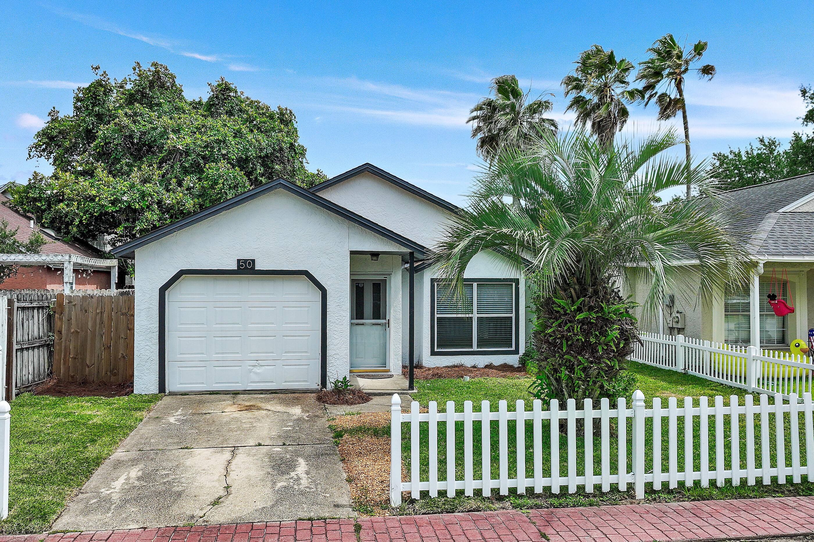 Located just a short walk to the harbor, this 2 bedroom/2 bath property is one of the best deals you will find for a house in all of Destin. Recent updates to this home include newly painted exterior, new water heater, newly sodded front yard, new garage door opener, and the roof is just two years old. The location of this community is ideal as it's very near the Destin Bridge, and all of the restaurants and boating that the Destin harbor is known for is just a walk or bike ride away. This home will not last long, come take a look at why it's the best value in Destin. Buyer to please verify all information.