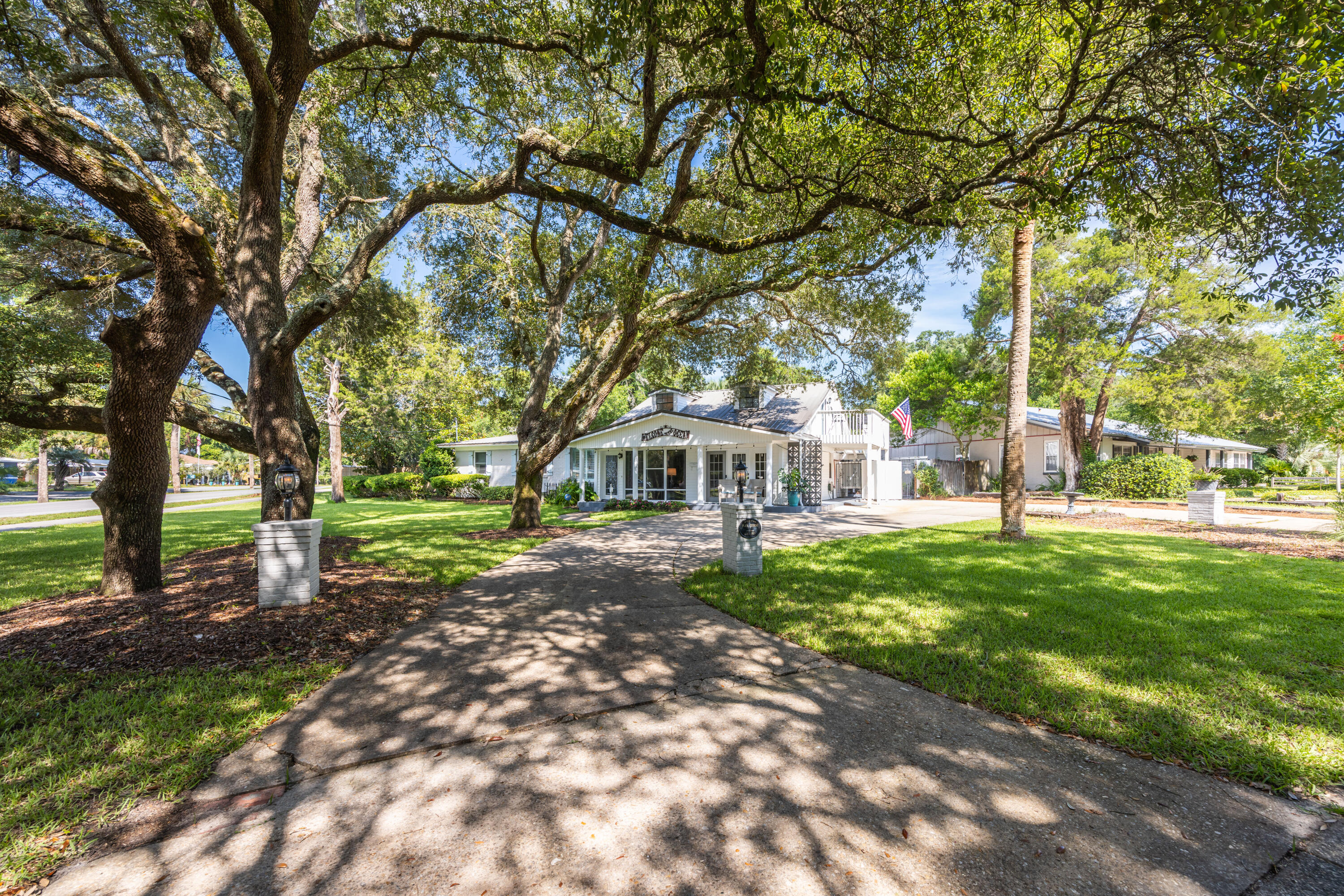 Experience the best of coastal living in this charming 5-bedroom home situated in the quiet, well-established neighborhood of Elliott Point.  With just a short drive to the beach or boat launch, this beautiful home blends the best of an Old Florida lifestyle with modern conveniences, and extensive outdoor living.   The main floor offers 4 bedrooms, 2 baths, kitchen, pantry, laundry, and two spacious living areas along with a large, screened patio just off the back dining room.  While the second floor brings a bonus space, currently used as a bedroom, with a half bath, and an over-sized balcony with peek-a-boo views of Choctawhatchee Bay.  The large backyard and garden areas include a brick grill-fireplace, a hot tub and gazebo, an outdoor shower, a peaceful lanai and fountain area, and a side driveway with two outdoor storage sheds.  The additional side driveway also offers space for an RV or boat.  In addition, this home is equipped with a whole-house water filtration system, a 50-gallon water tank, and an updated irrigation system with both front and backyard sprinklers. The seller is offering a home warranty and has a transferrable termite bond.  This home benefits from having no HOA, yet is close to the beach, restaurants, great schools, and all the abundance of water activities the Emeral Coast is known for.  Schedule your private showing today!