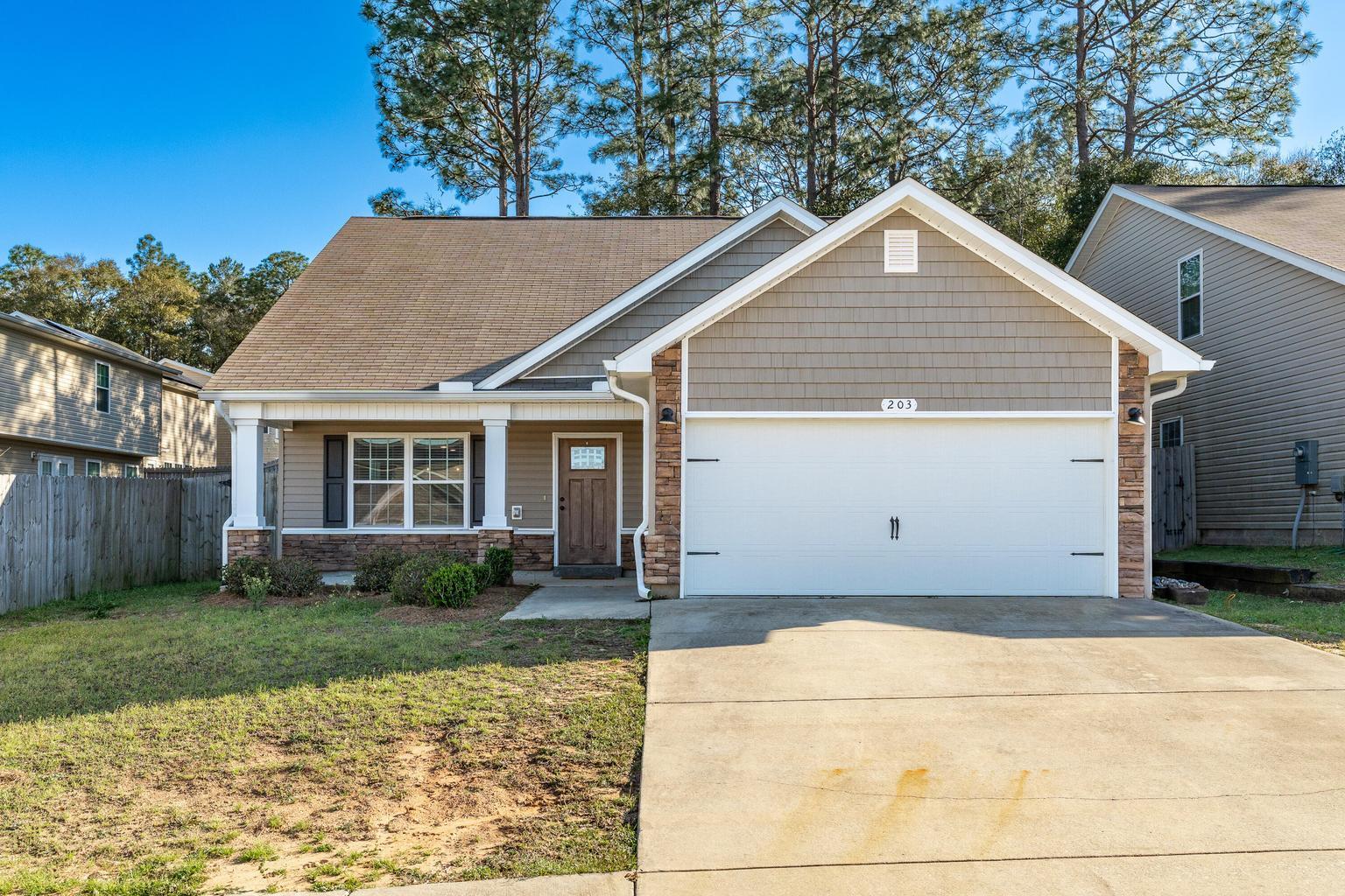 Want to own a like new home with a 3% Va assumable loan? Here is your opportunity! Located just 14 miles from Duke Field, this stunning Craftsman-style home features a spacious open floor plan designed for modern living. The bright and airy eat-in kitchen showcases elegant white cabinetry, warm Toasted Chestnut laminate flooring, a breakfast bar, and a seamless flow into the dining and family rooms--perfect for gatherings. The first-floor master suite is a private retreat, complete with a walk-in closet, dual vanities, a relaxing garden tub, and a separate shower. A convenient half bath and indoor laundry room are also located downstairs. Upstairs, you'll find a versatile media room and three generously sized bedrooms, each with ample closet space.