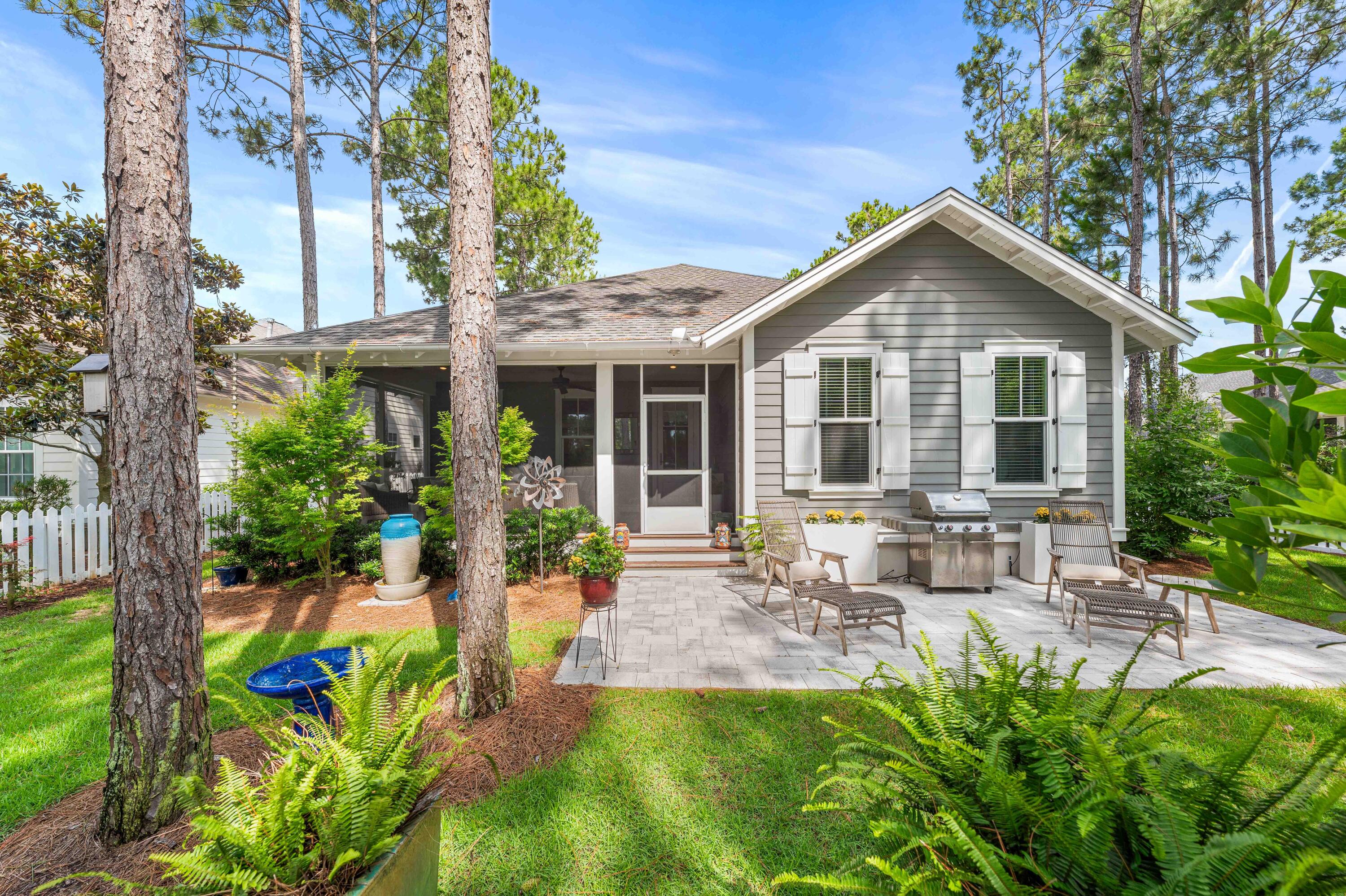 Welcome to the heartbeat of Watersound Origins! Tucked into a coveted Phase 1, Winter Garden location, this home is wrapped in natural beauty, with peaceful nature paths bordering two sides of the property, creating a complete sense of seclusion rarely found this close to the center of the neighborhood. This home is just a two-minute walk from your front door, to the community pool, golf course, and amenity center, making this home very accessible. Step on to the large screened-in back porch and experience something truly special; a serene, private setting backing onto the community park. The backyard feels like your own tranquil retreat, designed for seamless indoor-outdoor living.
This unique Edelweiss Plan features 4 bedrooms, 4 bathrooms, a separate enclosed office, and almost 2,500 square feet, of single-level ranch style living. Designed with both everyday comfort and entertaining in mind, this well-balanced floorplan will surprise you with large, comfortable room sizes throughout.

The current owners have made numerous improvements including approximately $25,000 in professional landscaping and hardscape, gutters, a split HVAC system in the garage, and a new HVAC system installed in 2024. Olive and fruit trees complete the fenced in backyard. In the dining room, there is a custom dry bar complete with built-in cabinetry, wine fridge, cypress shelving and there is a Sonos system with speakers throughout the home. The spacious primary suite offers a large walk-in closet, soaking tub, and separate walk-in shower, additional bedrooms and enclosed office provide flexibility for guests, working from home, or growing families. The home has hardwood floors throughout. 

Watersound Origins residents enjoy a resort-style pool, fitness center, playground, tennis, pickleball, and additional sports courts. Residents also have dock access to Lake Powell, and miles of walking and biking trails. The renowned Origins Golf Course, is recognized as one of the top par-3 courses in the world. Nearby Watersound Town Center offers convenient access to dining, shopping, Publix, Starbucks, medical offices, and community events throughout the year. With no short-term rentals allowed, Watersound Origins offers a true sense of community while remaining just minutes from the white sand beaches of Inlet Beach and scenic Highway 30A. Home is sold unfurnished. Buyer to verify all information and dimensions.