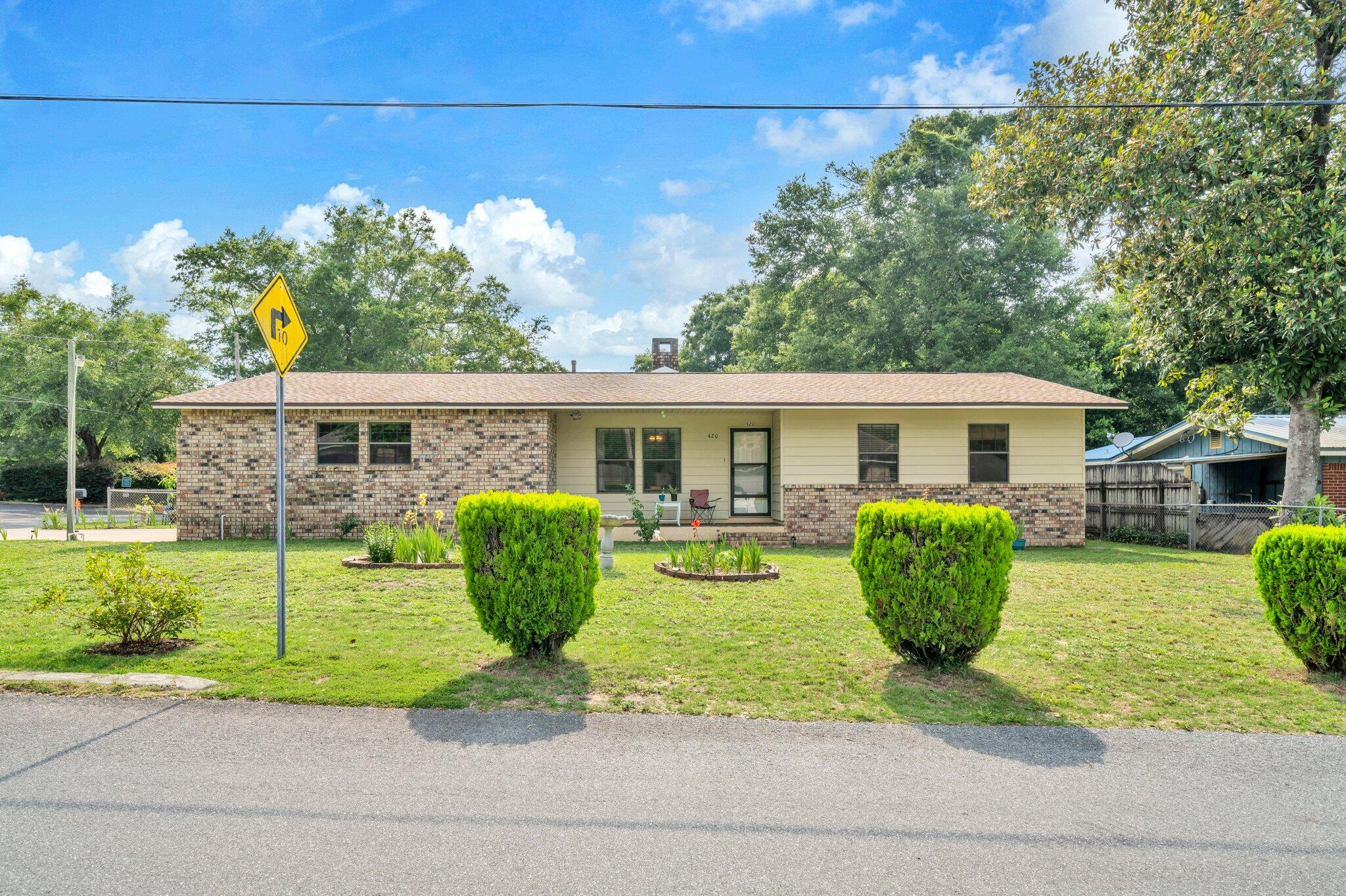 This inviting 3-bedroom, 2-bathroom ranch-style home offers 1,347 square feet of open living space on a 7,177-square-foot lot. the property features a complete new roof with all deck board replacement (90) done in march of 2025!
Property includes a clean, enclosed, powered and air conditioned 12'X20' workshop. Additionally, on property, is a separate sturdy storage shed. 
This exceptional house has 3 separate entry doors for this corner lot property. The interior boasts a cozy fireplace, a jetted bathtub in the master bathroom, and a well proportioned kitchen with modern appliances. Additional amenities include a 2-car attached garage, a carport, and a fenced backyard, perfect for outdoor activities. Located in the heart of Niceville.This home is close to schools, shopping, and recreation.