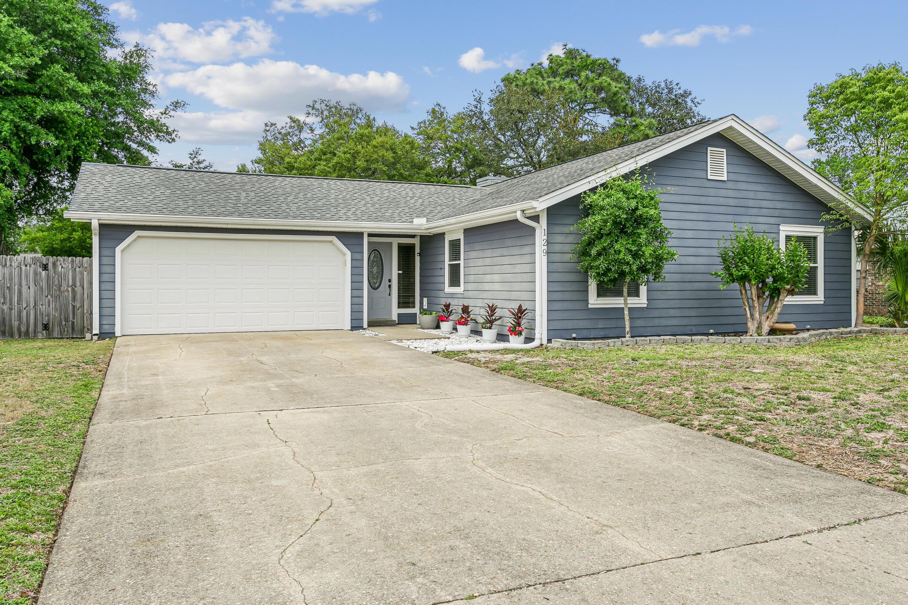 Beautiful VA eligible home with many upgrades in the Heart of Fort Walton!  Stainless steel appliances and premier flooring throughout. Primary suite features double vanity, garden tub, and shower with large closet. Second living area with built in bar. Home is perfect for entertaining. Two car garage has half bath for entertaining guests or watching football games with friends. Outdoor patio is perfect for those summer bbq's and night time bon fires! Roof replaced in 2021, HVAC replaced in  2021, Electrical Panel upgraded in 2023 and Water Heater replaced in 2024.  Contact listing agent for more info!
