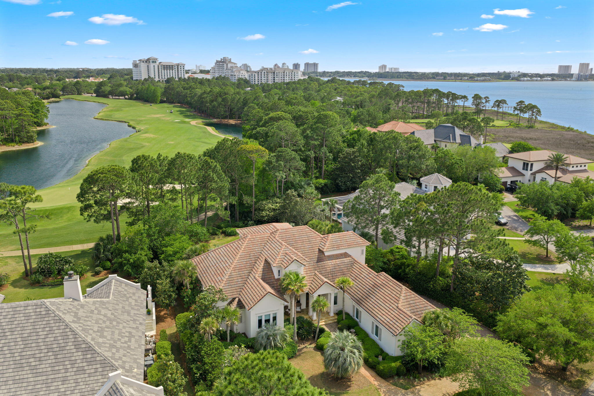 NEW PRICE!!!Located on one of The Most Desirable Streets in the Gated Community of Burnt Pine, situated within the Exclusive Sandestin Golf and Beach Resort is this Custom 4 Bedroom 6 Bath home overlooking the 16th Green.
This Timeless Designed Home Sits on a .5 acre lot boasting expansive Golf and Water Views. This picturesque setting is  surrounded by mature trees & lush manicured landscaping. The Classic Interior features  an Open Floor Plan with 12 foot ceilings on the First Floor ,with natural stone & hardwood flooring. Gourmet Kitchen with custom cabinetry, large island, dining room and keeping room. First Floor also features a Large Private Primary Suite with 2 Large Walk In Closets and Office all Overlooking the Lake and Golf Course. Pool, Summer Kitchen & 3 Car Garage. Upstairs has 3 bedrooms