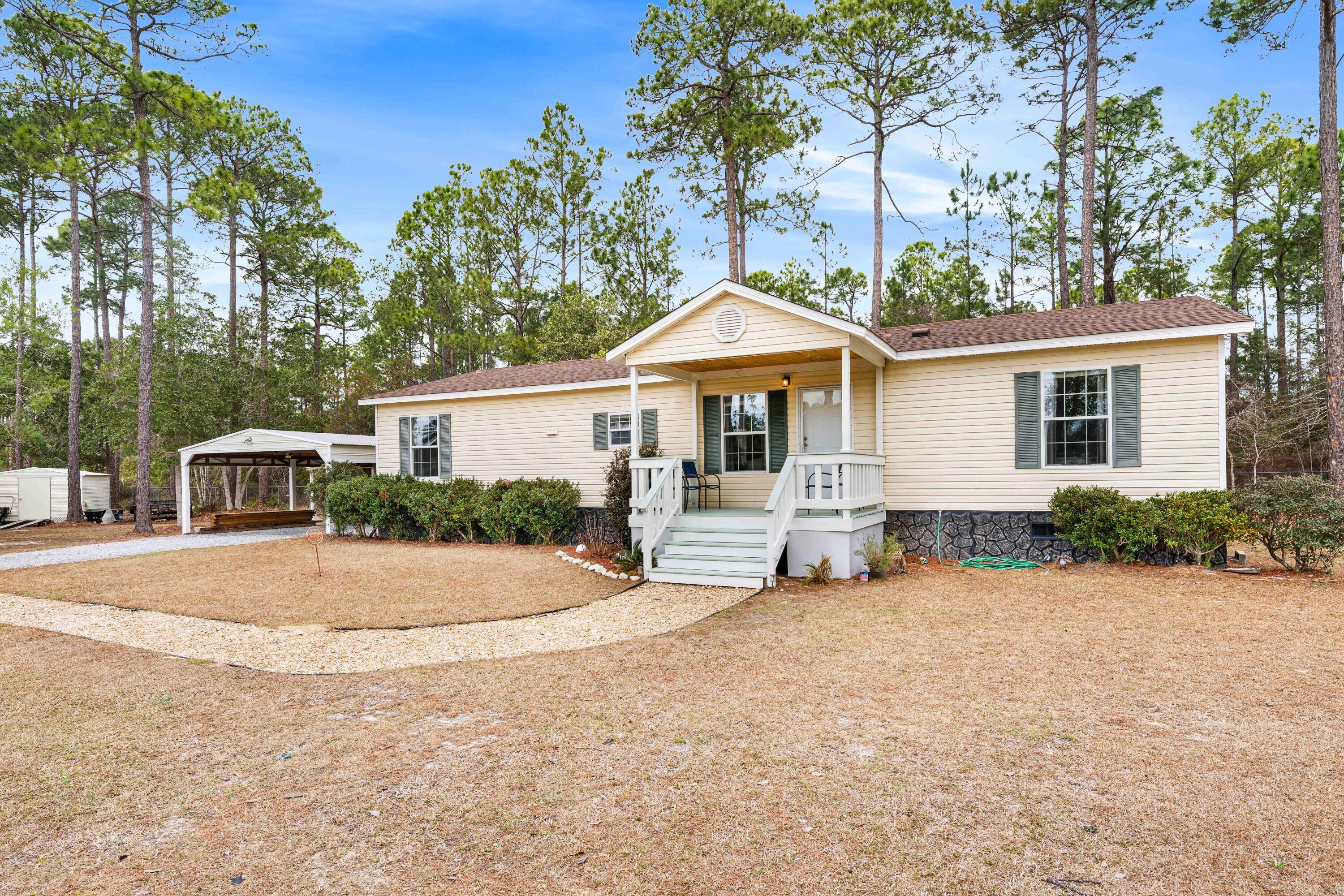 Awesome setting in Freeport, Florida at the end of a cul-de-sac on a .6+ acre lot. Located in the Black Creek area and close to nearby the public boat launch. 

The home has been maintained well.  The kitchen is open and has tons of cabinets and counter space.  The home has a screened in back porch. Property includes a double carport and shed (12' x 24'). The insulated shed features recessed lighting and acoustic ceiling tile and may be used as a workshop, home office, or studio. It is wired for cable, includes a window unit A/C, and has a bathroom with shower. The setting is quiet and the yard is private!