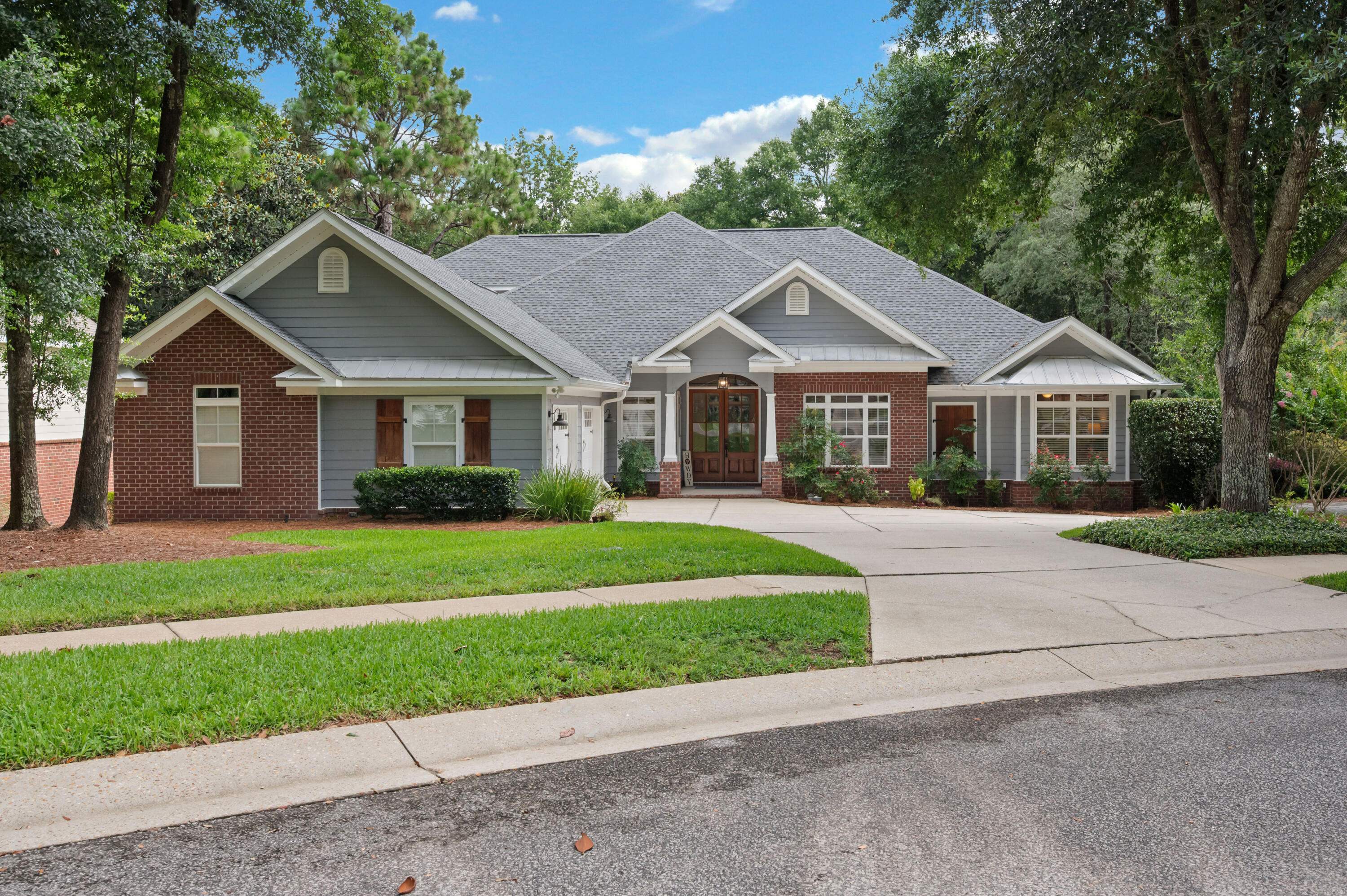 You'll fall in love with this beautiful Craftsman-style home the moment you pull into the driveway! Nestled on a quiet cul-de-sac in the highly sought-after Swift Creek community, this home backs to a peaceful greenspace, providing exceptional privacy and the perfect setting for relaxing or entertaining.
The spacious primary suite is a true retreat, featuring double vanities, a separate shower, a walk-in closet, and a cozy sitting area or home office complete with its own fireplace, the perfect spot to read a book or unwind while watching TV. The inviting family room showcases a stunning coffered ceiling and a wall of windows that fill the home with natural light while overlooking the private backyard. The kitchen has been thoughtfully updated with 2020 appliances, and the island was refreshed in 2022 with new countertops, fresh paint, and updated hardware. Additional upgrades include a Rinnai tankless gas water heater, 2022 HVAC system, and a new roof installed in 2023. Custom details are found throughout, including crown molding, elegant tray ceilings, a convenient drop zone just inside the garage entry, and a spacious laundry room with cabinetry. Need extra storage? The oversized garage offers plenty of room for an additional refrigerator and is already equipped with a water line for an ice maker. Living in Swift Creek means enjoying exceptional neighborhood amenities, including a community pool, tennis courts, basketball court, scenic walking trails, and a picturesque pond with a gazebo--everything you need to embrace an active and relaxing lifestyle.
If you've been searching for a custom home with character, space, and a beautiful natural setting, this Swift Creek gem is one you won't want to miss!