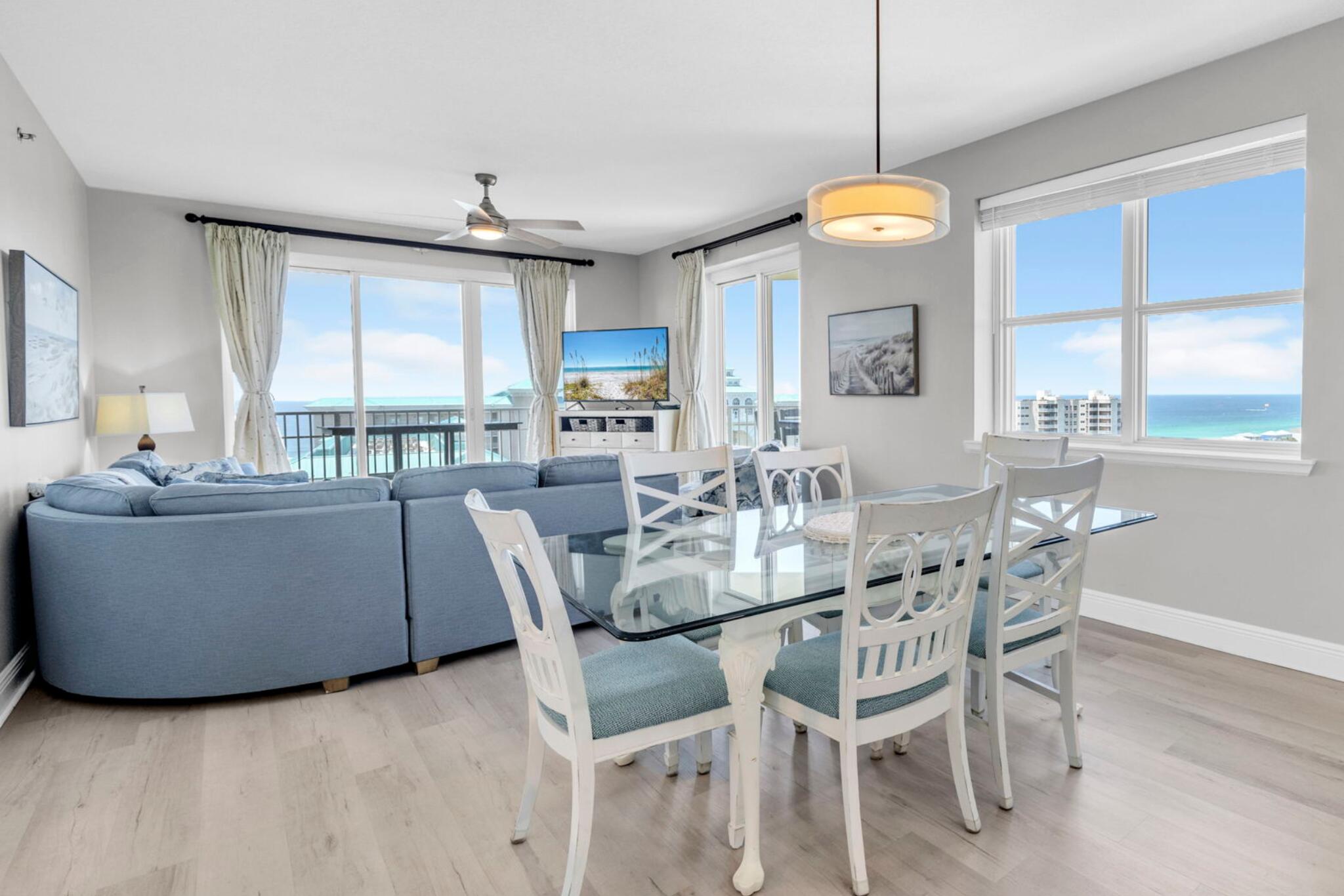 One of only a handful of west-end Corner units in Ariel Dunes I, this spacious 3 Bed / 3 Bath 14th-floor residence offers a view that simply cannot be duplicated! The expansive wraparound balcony showcases emerald Gulf waters, resort lake, and unforgettable sunsets all the way to the Destin bridge, while the second balcony off the guest bedroom overlooks the bay, golf course and Seascape's exciting new entertainment districts. Natural light pours through walls of windows highlighting the recently updated interior featuring beautiful LVP flooring, a custom built-in bar, stylish coastal furnishings, and an open-concept floor plan that's completely turnkey for vacation rentals, a second home, or full-time coastal living.  Located within the gated Seascape Resort, owners enjoy easy access to sugar-white beach, an 18-hole golf course, multiple pools, gym, an active tennis and pickleball community, walking and biking trails, on-site dining/ shopping and the vibrant Seascape Towne Centre all without leaving the resort.
