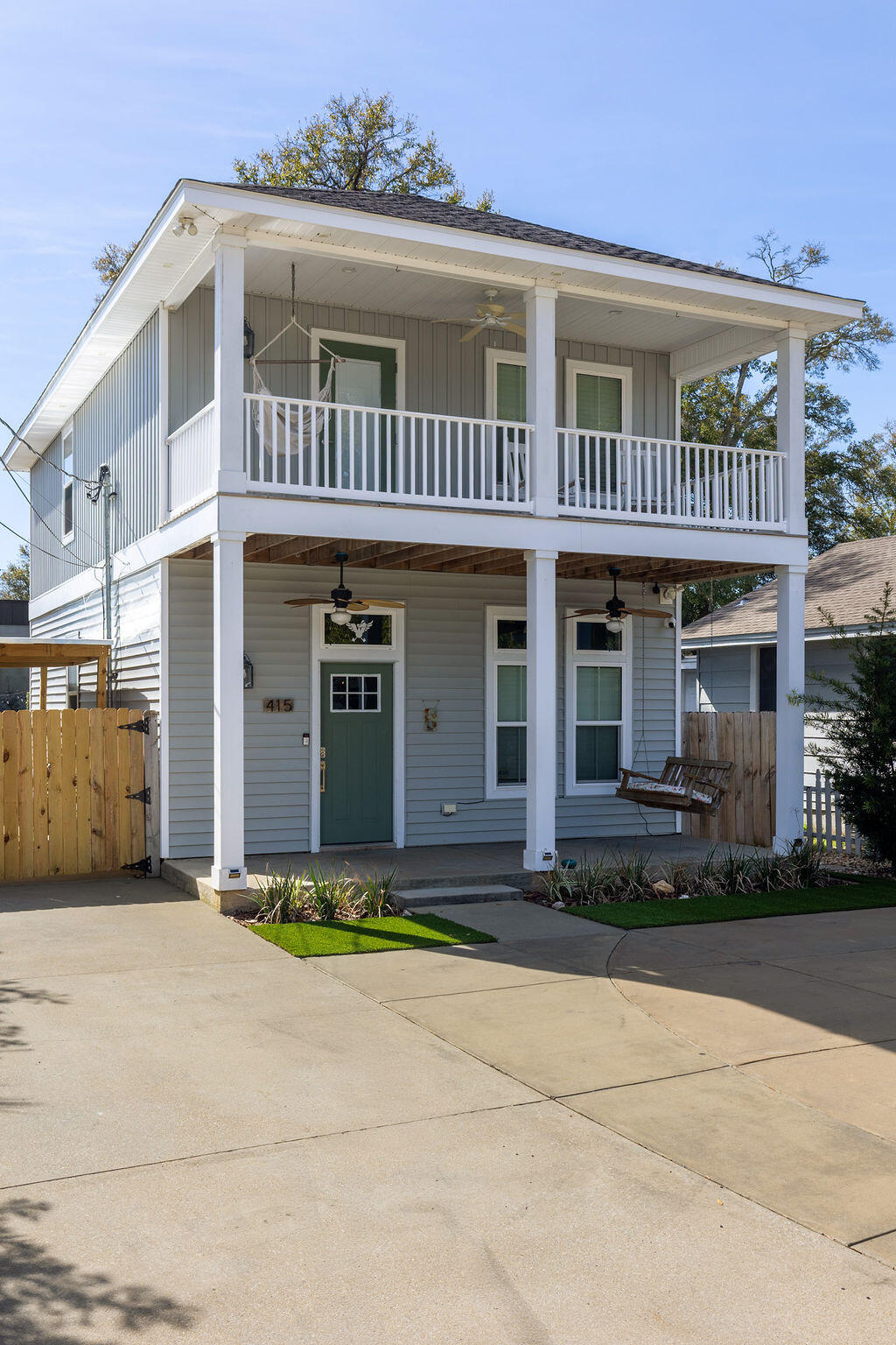 **Back on the market at no fault to seller, now is your chance!** She's a whole VIBE; not your average cookie cutter. This one feels different. Inside, bold, rich tones meet bright natural light, creating a space that feels both open and cozy. Soaring ceilings and an airy layout keep it light and inviting, while deep accent walls, warm wood details, and modern finishes add depth and character. It's just as perfect for slow mornings with coffee as it is for hosting friends on a Friday night. The kitchen is clean and modern with stainless appliances, crisp cabinetry, and a statement island that anchors the room. The custom bar nook adds just the right touch of personality; intimate, functional, and ready for happy hour. Upstairs, the bedrooms feel peaceful and tucked away, offering a quiet  retreat while still maintaining the home's stylish edge. But the real magic? The outdoor space. The backyard is thoughtfully designed for both relaxation and gathering. Artificial turf zones, natural rock beds, and string lights create a laid-back, low-maintenance oasis. There's room for fire pit nights, picnic-table dinners, and space to unwind under the trees. The covered patio extends your living space outdoors giving you the ideal spot for game day grill outs. Now let's talk functionality...long driveway with ample off-street parking, covered parking area for boat or vehicle storage, and a dedicated covered structure ideal for paddle boards, kayaks, bikes, and all other outdoor toys, plus it's fully fenced for privacy. BEST part? You're only 3 minutes from downtown Pensacola. This home doesn't just look good, it feels good. She's stylish, low maintenance, in a dream location, and designed for real life. Come swoon over her!