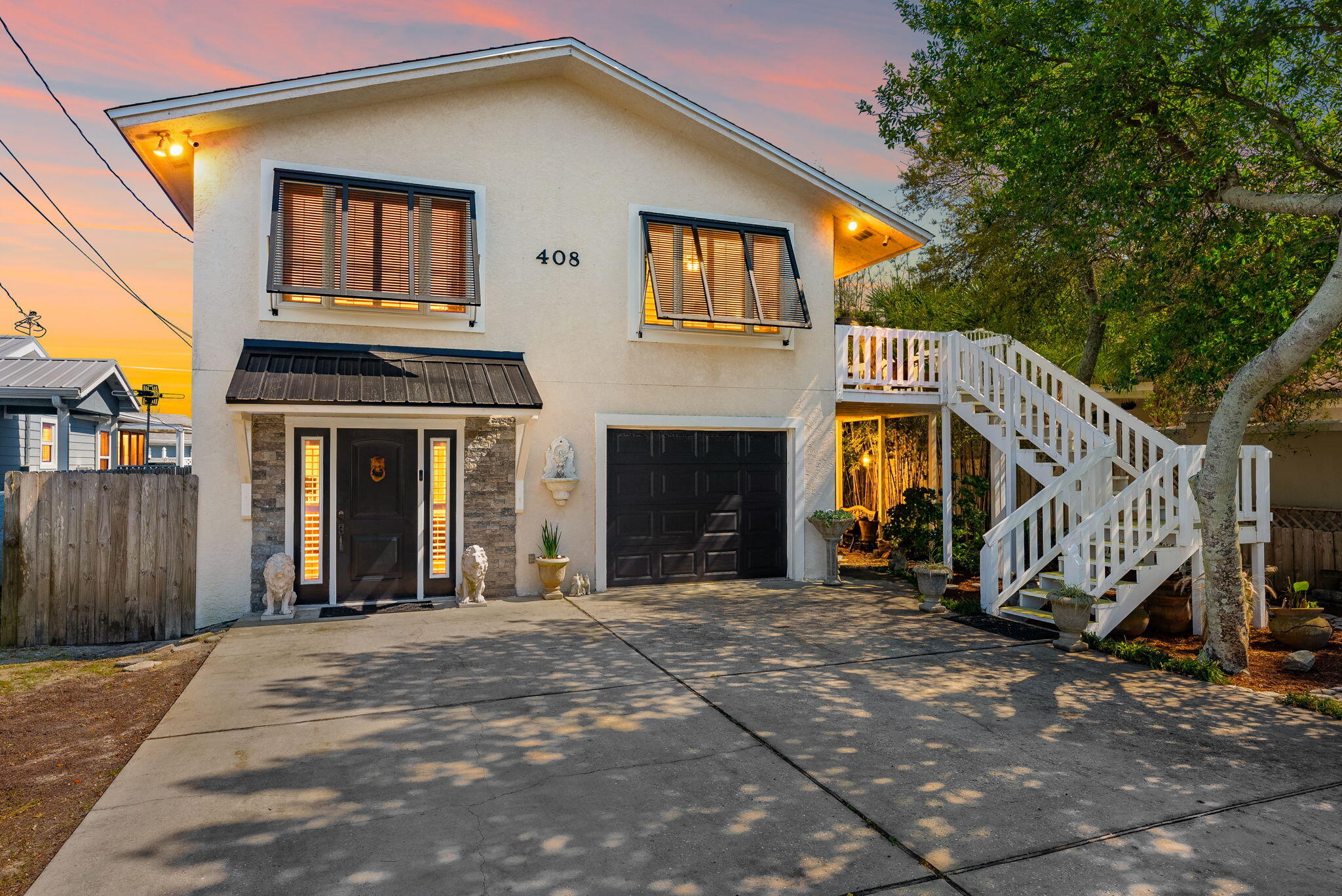 Welcome to 408 Dolphin Street, a rare opportunity to own in the highly sought-after Bid-A-Wee Beach community--one of Panama City Beach's desirable coastal neighborhoods. Located just two blocks from the only gated, private beach accesses in PCB, this home offers an exclusive beach lifestyle that is simply unmatched. Golf cart friendly community and there are no short-term rentals allowed on this street, creating a peaceful, residential setting perfect for a primary home or second home retreat. This spacious 4-bedroom, 3 full bath home blends charm, functionality, and thoughtful updates throughout. Inside, you'll find original 3 quarter-inch tongue-and-groove red oak hardwood floors, adding warmth and character to the living spaces. The flexible floor plan features two master suites--one on the main level and one upstairs--ideal for guests or multi-generational living. A downstairs bathroom is also wheelchair accessible, providing added convenience. Major updates have already been taken care of, including appliances that are just 3 years old with a double oven, a 4-year-old HVAC system, 2 security systems (ring and rep link), new mini split units, new front windows, and plantation shutters throughout the entire home. A one-car garage adds additional storage and functionality. Step outside to your private backyard oasis, complete with a sweet water well for irrigation (can also be hooked to the home if the water goes out), tranquil koi pond and mature fruit trees including banana, grape, pomegranate, and orange--creating a true Florida retreat. The pool has been recently updated with a new pump and an outdoor shower, perfect for after the beach or pool. While there is no mandatory HOA, there is a voluntary $100 per year contribution that helps maintain the private gated beach access--one of the most valuable and exclusive features of the Bid-A-Wee Beach community. Located in an established neighborhood, and exclusive access to Bid-A-Wee's private gated beach, this property offers a rare combination of privacy, location, and lifestyle. Call today to schedule a showing.