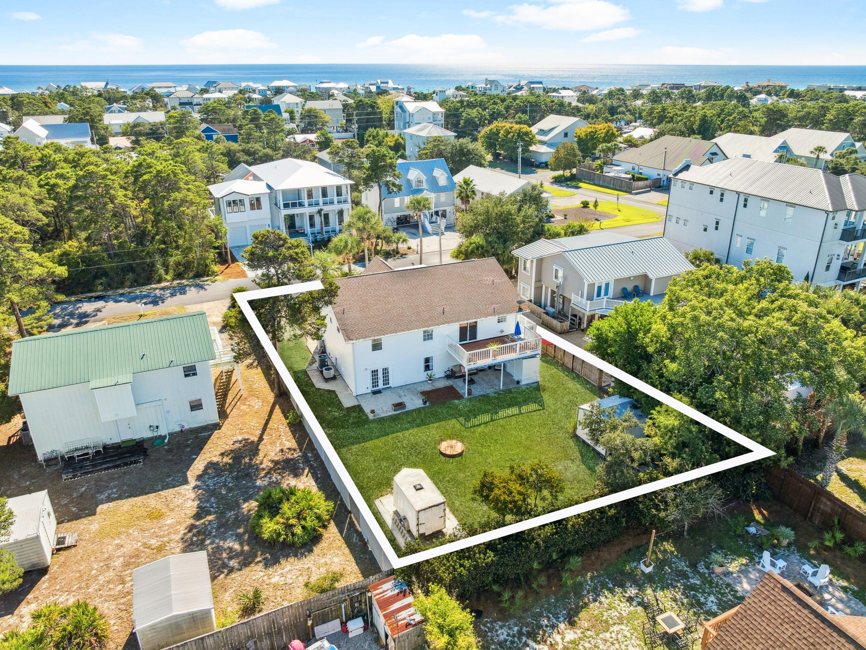 Back on the market at no fault to the seller! Buyer's  financing fell through. Just one block off Scenic Highway 30A and moments from the sugar-white sands of Gulfview Heights Beach, this rare coastal retreat offers versatility, space, and investment potential in equal measure. Set on an oversized lot with room to add a pool or guest house, The property offers two fully independent living levels--each with its own kitchen, private entry, parking, HVAC, and electric meter--making it ideal as a duplex, a rental opportunity, or a single-family home with extended living. Both floors are accessible from either the interior or exterior of the home. Depending on your needs, this five-bedroom, three-bath layout also includes a large office and generous gathering spaces both upstairs and downstairs An enclosed gulf-side porch and an expansive north-facing deck invite coastal breezes and easy entertaining, while recent updates, fresh interior and exterior paint, new water heaters, upgraded appliances, and whole-home water filtration system , underscore the home's move-in readiness. Additional features include a circular driveway, a central vacuum system on both floors, a storage shed, a large walk around attic space makes for endless possibilities, and a whole-home termite bond. This beautiful home is truly move-in ready, offering both comfort and convenience from day to day. 
Situated on the quiet west end of 30A between Dune Allen and Blue Mountain Beach, the property enjoys quick access to Ed Walline Regional Beach Access and the Longleaf Greenway trail into Point Washington State Forest. Shops, restaurants, and entertainment at Gulf Place are within walking distance, and a six-seat street-legal golf cart is included for effortless exploration of 30A. With no HOA fees, this home offers an exceptional opportunity to enjoy, rent, or reimagine one of the most flexible properties along the Emerald Coast.