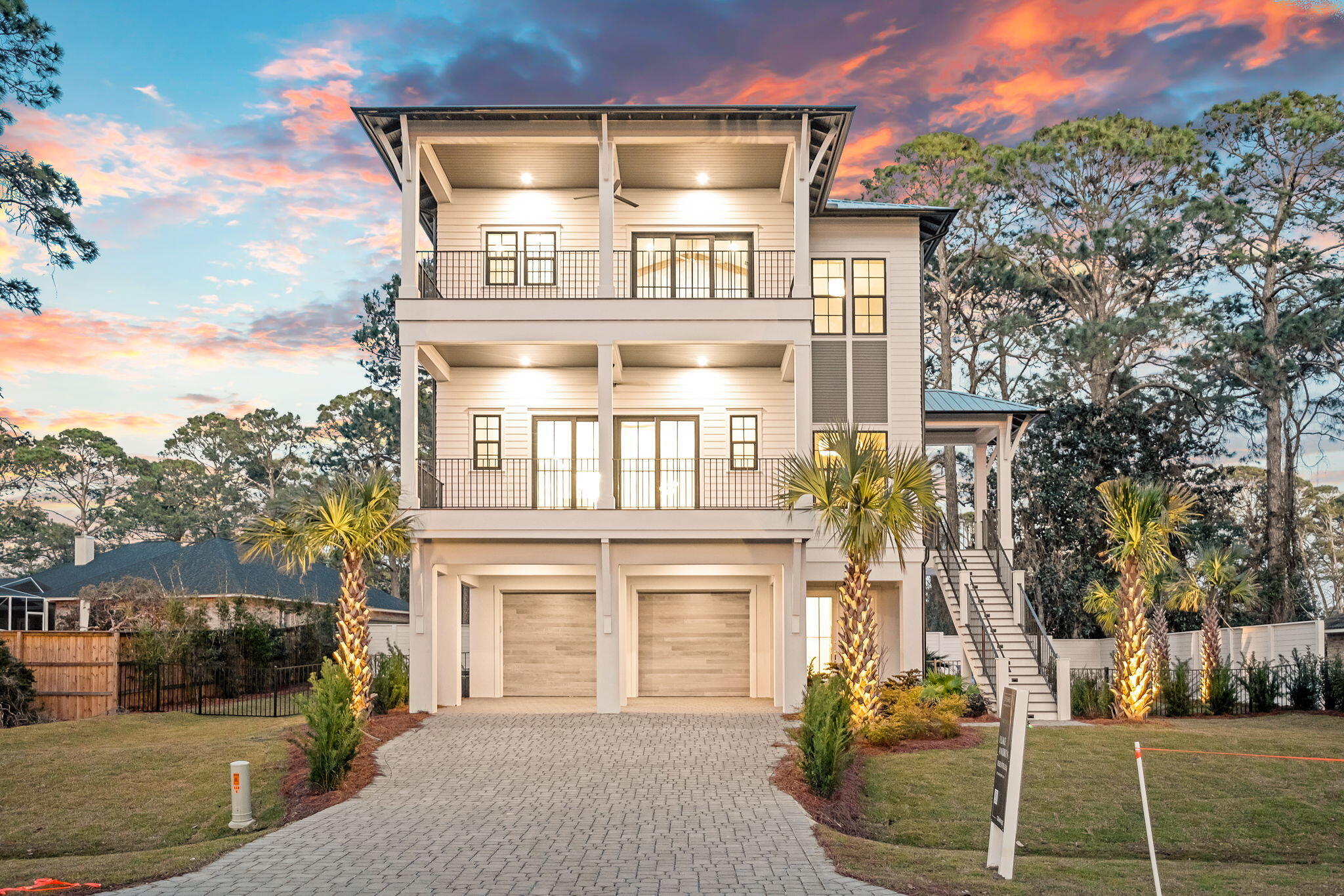 Just off the west end of Scenic 30A, 588 Allen Loop Drive delivers lakeside living with a modern edge. This newly built five-bedroom home rises three stories, offering layered outdoor spaces, clean architectural lines, and sweeping views from every angle.

On the second level, open concept dining and living flow out to generous covered porches, perfect for slow mornings or sunset cocktails. At the top, a private rooftop terrace is designed for your relaxation and comfort.

Steps from public beach access and minutes to Grand Boulevard, Topsail Hill Preserve, and South Walton's best dining and retail, the location balances privacy with prime access. Quiet. Coastal. Convenient.