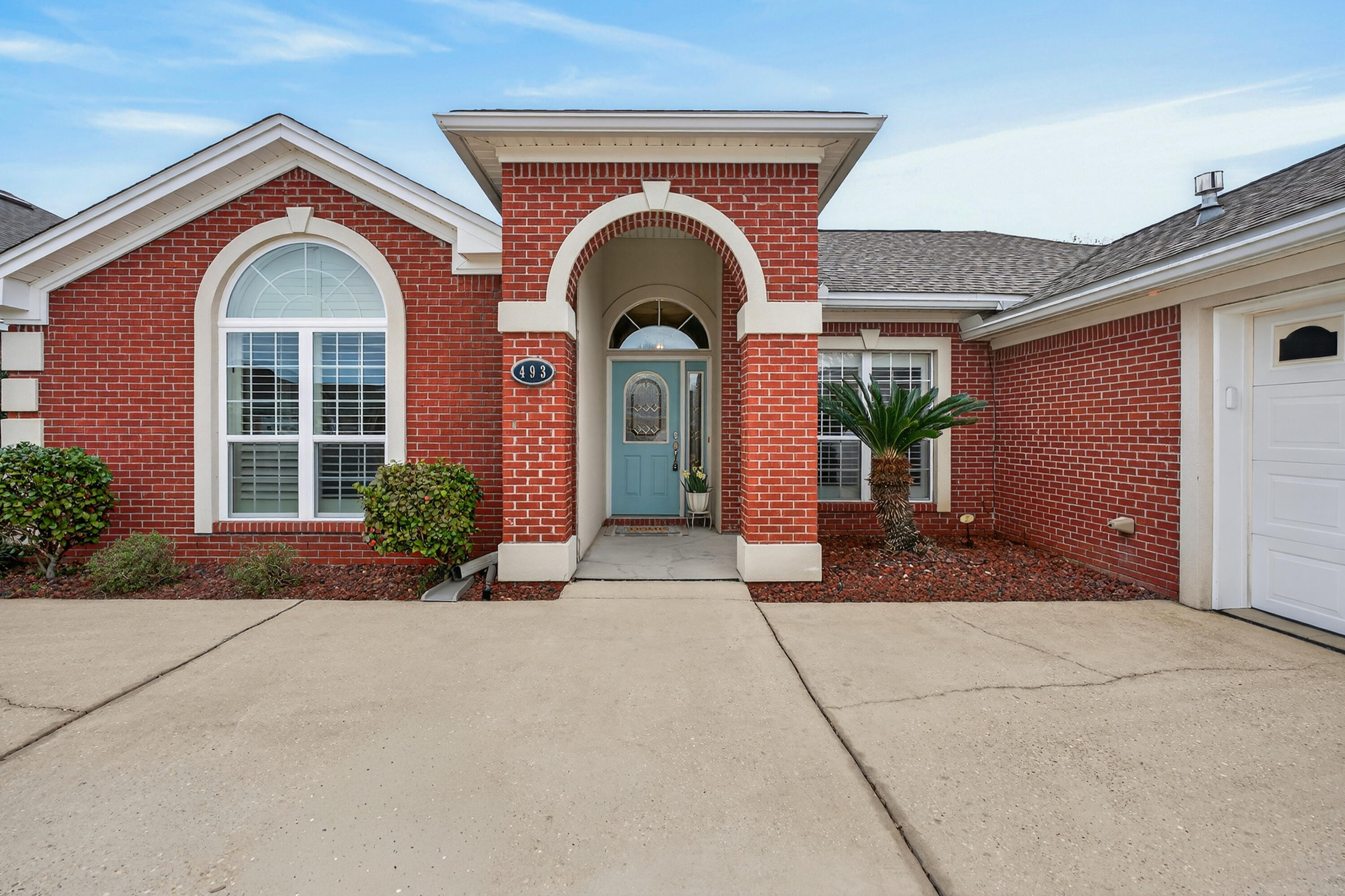 This beautifully maintained 4-bedroom, 2-bath brick home with a dedicated office and heated/cooled Florida room, is perfectly positioned within the gated community of Bridgeport Colony in Fort Walton Beach. Thoughtfully designed and centrally located, this home blends comfort, function, and the kind of easy coastal lifestyle that makes every day feel like a getaway.

Step inside to a spacious foyer where rich hardwood floors lead you into a warm and inviting living area, complete with brand-new carpet and a cozy gas fireplace--perfect for relaxed evenings or hosting friends. Double French doors with built-in blinds open to a light-filled Florida Room, fully heated and cooled, creating a versatile space ideal for morning coffee, weekend gatherings, or your own sun-drenched retreat. The eat-in kitchen is both stylish and practical, featuring granite countertops, warm-toned cabinetry, stainless steel appliances, and a breakfast bar ready for everything from casual mornings to entertaining dinners with friends and family.

A split floor plan offers privacy and flexibility, with three secondary bedrooms and a full bath tucked behind a pocket door--creating a quiet wing for family or guests. On the opposite side, the spacious primary suite feels like a true retreat, showcasing tray ceilings, a cozy sitting area perfect for a reading nook, and an ensuite bath with a garden tub, double vanity, separate shower, and a generous walk-in closet.

Meticulously cared for and thoughtfully updated, this home includes brand-new carpet and padding, fresh interior paint, deep-cleaned tile flooring, a new picture window in the front bedroom, all new HVAC unit and duct work installed in 2023, and a newer roof replaced in 2020--giving you peace of mind from day one.

Out back, evenings come alive under the pergola--an inviting space for grilling, gathering, and enjoying the Florida breeze. The exterior is also equipped with convenient outlets for holiday lighting, landscape features, and added ambiance year-round.

Life in Bridgeport Colony means gated security, a community pool, and a welcoming neighborhood feel. And with close proximity to Eglin Air Force Base, Hurlburt Field, and the sugar-white shores of Okaloosa Island, you're perfectly positioned to enjoy both convenience and the coastal lifestyle that makes this area so special.

This is more than a home--it's the backdrop for everything you've been imagining.