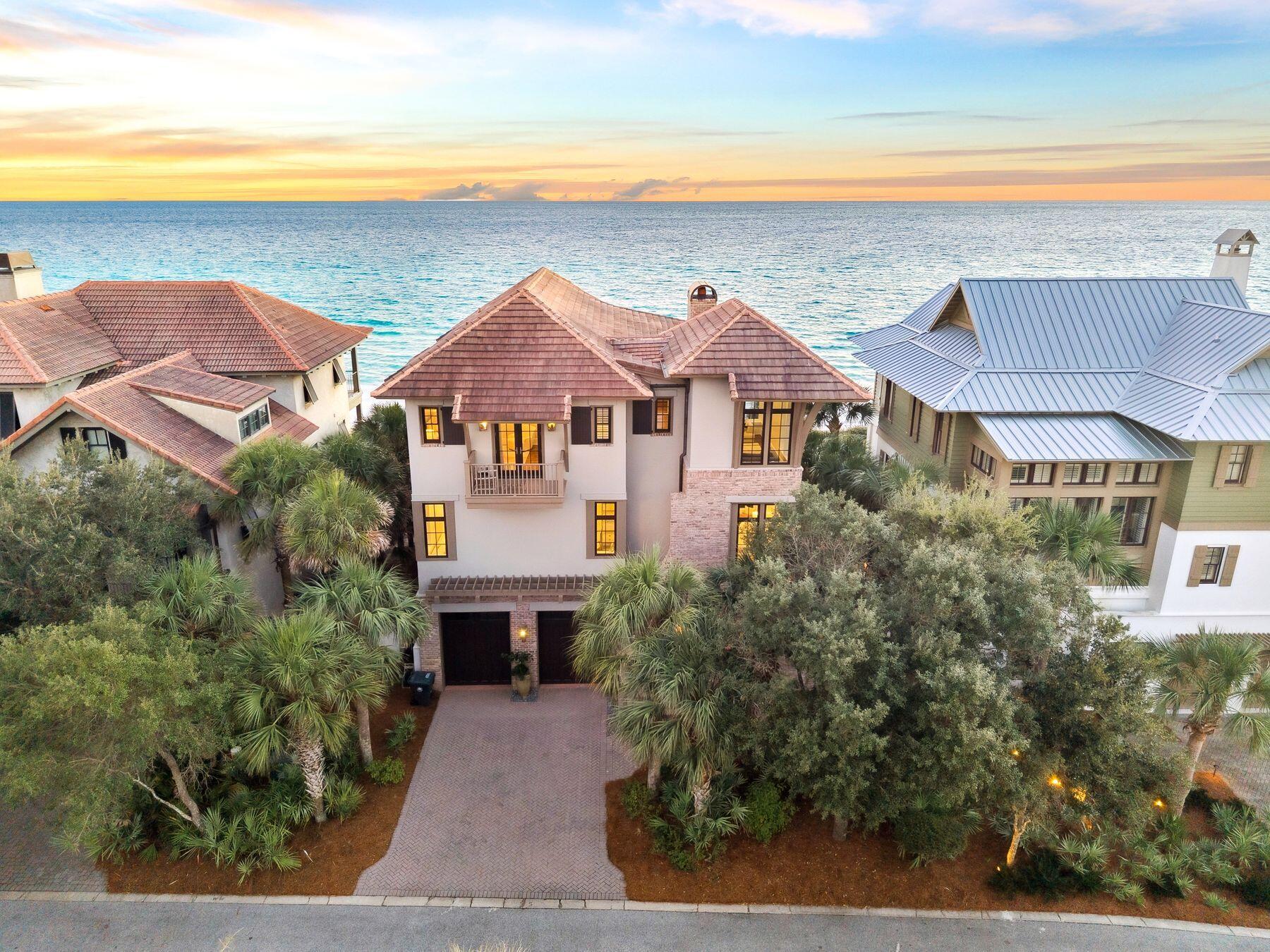Perched atop manicured dunes within the exclusive gates of The Retreat, this stunning, artfully curated estate redefines coastal luxury. The Retreat welcomes residents with lush greenery, generous homesites, and the newly reimagined Beach Club—an amenity unmatched on 30A's coveted west end. At 131 W. St. Lucia Lane, timeless architecture meets modern sophistication. Designed by the late Dawn Thurber and brought to life by Davis Dunn Construction, this home stands as a testament to artistry and craftsmanship.Built entirely of concrete, the home exudes enduring quality, while a heated gulf-front pool, summer kitchen, and fire pit create an idyllic space for relaxation and entertaining.Inside, thoughtful textures and curated details blend heritage with contemporary design. The first level includes a gulf-view guest suite, flex room, and two-car garage with elevator access. The second floor unfolds into a stunning open-concept living area featuring formal dining, a chef's kitchen with Wolf and Sub-Zero appliances, reclaimed maple flooring, and dual seating spaces anchored by a brick fireplace. Expansive glass doors open to a covered terrace framing endless views of the Gulf. The first level features a gulf-view guest suite, a flex room, and a two-car garage with elevator access. The second floor unfolds into a stunning open-concept living area, featuring a formal dining space, a chef's kitchen with Wolf and Sub-Zero appliances, reclaimed maple flooring, and dual seating spaces anchored by a brick fireplace. Expansive glass doors open to a covered porch framing endless views of the gulf. A guest suite with expansive windows featuring gulf views and media room with an adjoining bath completes this level. The third floor offers an exquisite primary suite with sweeping gulf vistas and a marble-clad bath that defines indulgence. Two additional bedrooms are adjoined by an en suite bath with the western suite capturing panoramic views of both the Gulf of America and Draper Lake.  131 W. St. Lucia Lane is more than a home - it's a refined coastal sanctuary, perfectly blending elegance, craftsmanship, and breathtaking natural beauty.
