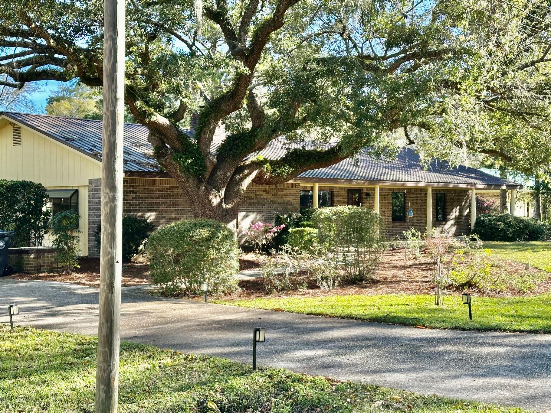 WATERFRONT! FISHERMAN'S PARADISE!  This one story three bedroom two and half bath brick home offers over 2200 square feet of heated and cooled living space.  Walk out the back door and you will find a wide deep water canal that can take you and your watercraft/boat to the fishing and water sports that the Choctawhatchee Bay and Gulf of America have to offer.  Set on nearly a half acre of land, you are located just 10-15 minutes from the white sandy beaches of 30A and all of the dining and boutique shopping it has to offer.  Enjoy the refreshing breezes sitting on your expansive front porch with your morning coffee or an ice cold beverage in the afternoon coming off of the bay.
