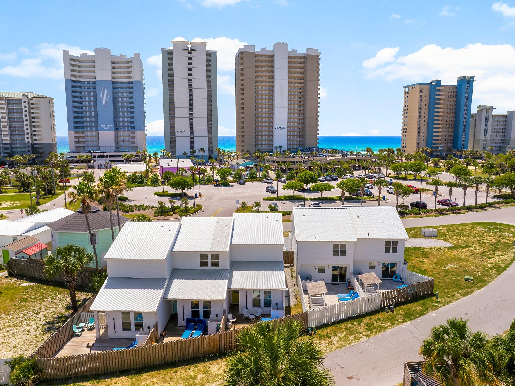 * 5 Doors from the Shore - Invest in Style & Income!* Investor's dream in Panama City Beach! This exceptional turnkey rental package includes a beautifully designed triplex and duplex, sold together and fully furnished for immediate income generation. Built in 2020, the triplex offers over 4,000 square feet of thoughtfully planned space, featuring 9 bedrooms and 9 bathrooms across three individually themed units: The Beach Cabana, The Groovy Shack, and Welcome to Paradise. Each unit is uniquely styled to provide guests with a one-of-a-kind, Instagram-worthy experience, complete with private entrances, vibrant exterior doors, and modern coastal finishes that capture the laid-back beach vibe. The adjoining duplex adds another 2,800 square feet of living space, offering 4 bedrooms and six  bathrooms across two distinct units: The Surf House and The Tropical House. Like the triplex, these units continue the playful, curated design aesthetic and are optimized for maximum guest appeal and rental performance. Every unit has been thoughtfully furnished and is fully equipped, making this a true plug-and-play investment opportunity. Guests will love the short walk to the Gulf, where they can enjoy white sandy beaches and turquoise watersmaking these rentals even more attractive in Panama City Beach's thriving vacation market. With strong rental history and impressive income (figures available upon request), this property is already a high-performing asset with even more room to grow. Plans are in place for a 3-bedroom townhouse to be added on the west side of the lot, offering future expansion potential and additional income opportunities. Located just minutes from popular dining, shopping, and entertainment, this property package delivers the perfect combination of location, lifestyle, and long-term value. Whether you're looking to expand your portfolio or break into the short-term rental space, this opportunity checks all the boxes.