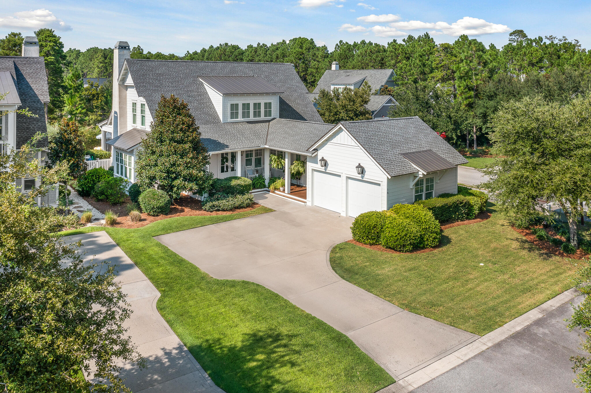 Discover refined coastal living in this stunning Romair-built home perfectly positioned on a premier corner lot in the highly sought-after Watersound Origins community. Surrounded by mature landscaping for privacy and serenity, this property offers an exceptional indoor-outdoor lifestyle with a private pool, spa, and a covered cabana featuring a wood-burning fireplace. A large screened porch with a custom-built outdoor kitchen creates the ideal setting for alfresco dining and year-round entertaining.

Inside, the thoughtful floor plan provides effortless flow and beautifully curated designer finishes. The expansive great room is the heart of the home, boasting a spacious dining area, a generous living space with fireplace, and a chef-inspired kitchen with gas range, stainless