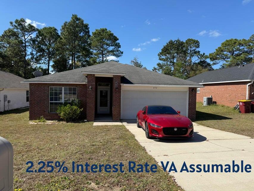 Beautiful home in the heart of Crestview and a perfect location for getting to the military base! VA assumable loan 2.25%!!!!!! New roof and carpet allowance with acceptable offer. This charming 3 bedroom and 2 bath home in Redstone Estates has 1822 sq ft! The home has an open floor plan with the kitchen opening to the dining room and living room with large case openings. Enter the home in a foyer and there is a huge great room with a recessed wall for media equipment and flat screen TV perfect for entertainment or gaming. There are double windows in the living room allowing for natural light. The kitchen features an island, a side by side refrigerator, dishwasher and oven/stove. The kitchen also has sliding glass doors to a large open deck and open shelving! The dining room also has a window and a chandelier. The primary bedroom is large and has an ensuite bathroom. The primary bathroom has a double vanity, soaking tub/shower combination, and a large walk in closet with shelving. There are two additional guest bedrooms and a full bath.  The home has a two car garage with automatic opener, extra parking in the driveway, and a beautiful back yard with privacy.  In addition the lights, ceiling fans, gutters, and more have been updated. Redstone Estates is a sought after neighborhood due to the convenience of being close to schools, shopping and restaurants. Great home and located in a perfect location! Buyer to verify all dimensions and information.