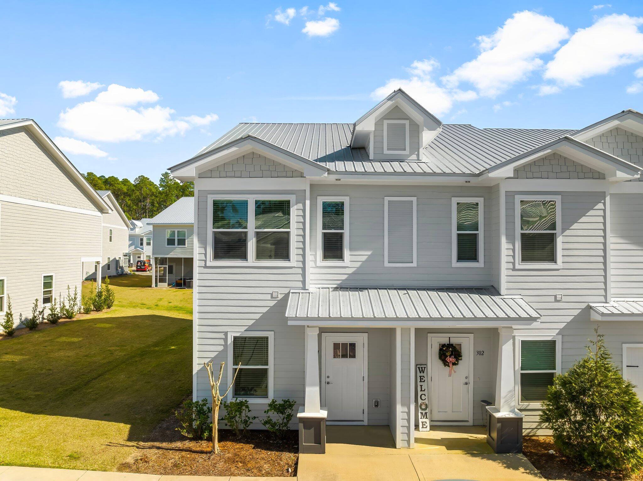 Beautiful quiet end unit with one of the largest floor plans. Quiet tranquil setting, relaxed lifestyle with the luxury of the beautiful white sandy beaches 12 minutes South. Covered and fully screened-in back porch area, quartz counter tops, LVP flooring and carpet throughout, all stainless appliances, mini blind window coverings, community pool, 3 beds, 2.5 baths.

Community offers a full playground and pickle ball courts as well as a beautiful community pool and gathering area.  Unit is ready now bring all offers...