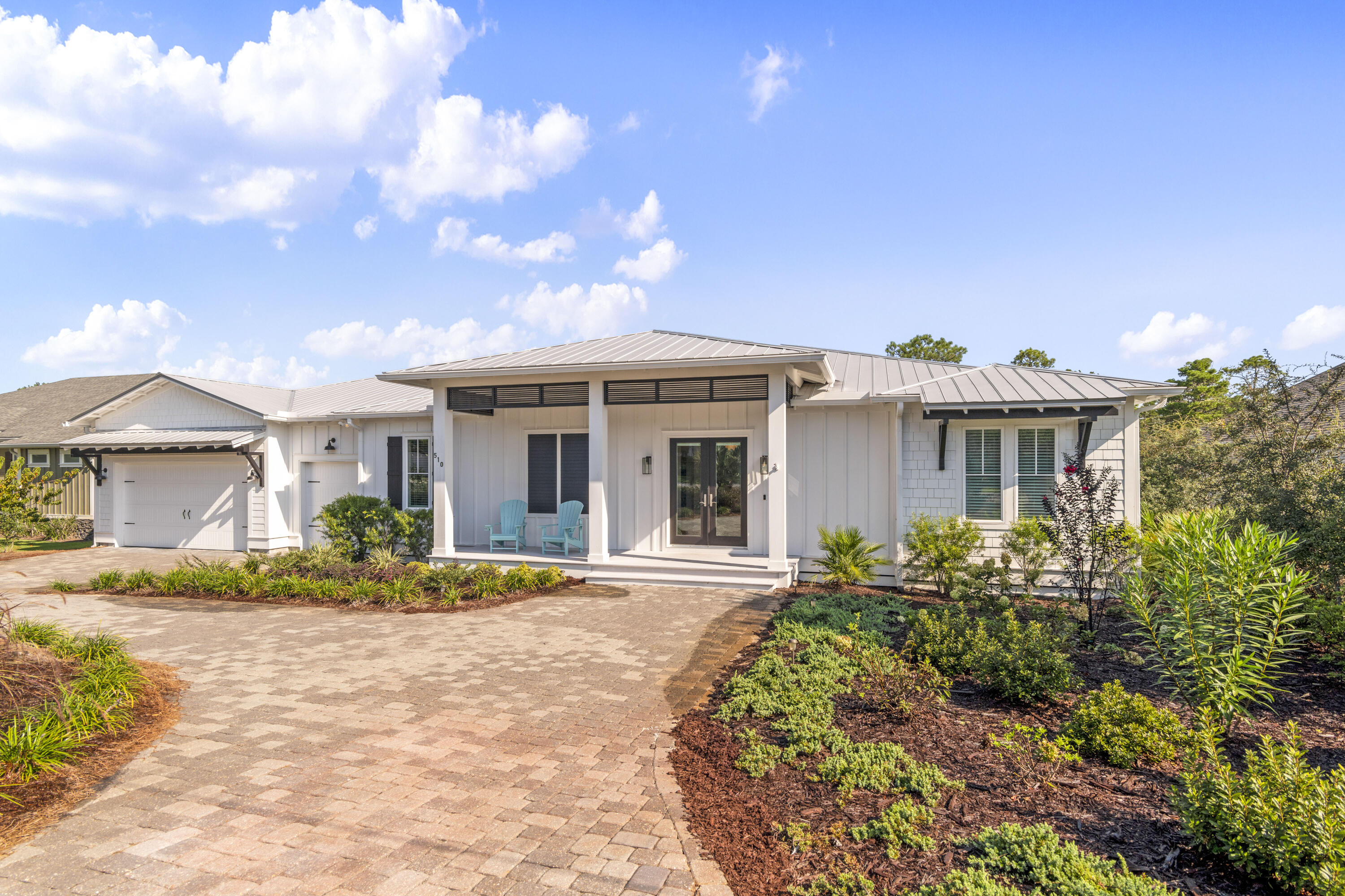 Amenities Galore on the West End of 30A!

Discover this beautifully appointed single-level home ideally located on the highly desirable west end of 30A, just minutes from the beach, Gulf Place, dining, shopping, and entertainment. Tucked away in a quiet neighborhood with no HOA, this property offers the perfect combination of privacy, convenience, and resort-style living.

The backyard is a true private oasis featuring a full-size pool with a sun shelf, elegant travertine decking, a built-in putting green, landscape lighting, and lush mature landscaping. Adding to the serenity, the property backs up to protected state-owned land, ensuring lasting privacy with no future development behind you. Low-maintenance turf throughout means no grass to mow and more time to enjoy the coastal lifestyle.

Inside, the home showcases a chef's kitchen equipped with premium Thermador appliances, including a built-in 48-inch refrigerator and a full-size wine refrigerator. The thoughtful floor plan offers comfortable one-level living, while the spacious rear porch with fireplace creates the perfect setting for outdoor entertaining year-round.

Additional features include a two-car garage plus a dedicated golf cart garage, making it easy to enjoy everything 30A has to offer.

This exceptional property combines luxury, privacy, and location in one of the Emerald Coast's most sought-after areas. Outdoor Kitchen. Large Rear 1000 sf Composite Deck with Pergola. There is a Sauna with Seating for 4 in the backyard that was custom built and is a great place to Relax and Detox. All Porches are Composite.