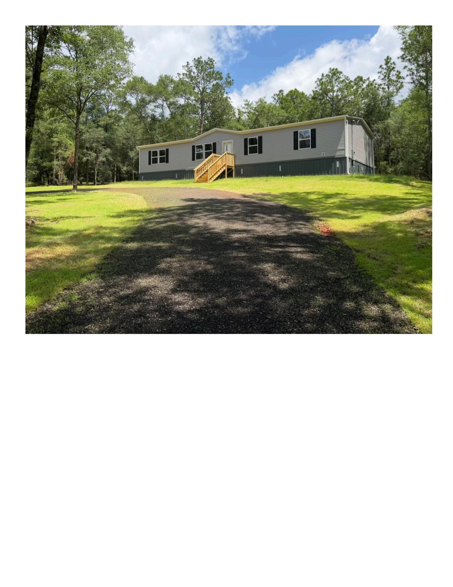 If you've been dreaming of your own little piece of heaven, this brand-new 2026 manufactured home is it!!! Offering 4 bedrooms, 2 bathrooms, and 1,971 square feet, this home sits on approximately an acre in a beautiful wooded setting with a cleared homesite. Inside, you'll love the open layout with two living areas and a kitchen with island that flows into the main spaces. The split bedroom design offers a private primary suite, while the additional bedrooms are on the opposite side of home. Enjoy that down-home country feel while being just a short drive to the beach and close to Pensacola, Eglin, Duke Field, and Whiting Field. Pics are taken from the manufacturers advertisement video of home. Home in to be delivered early May.