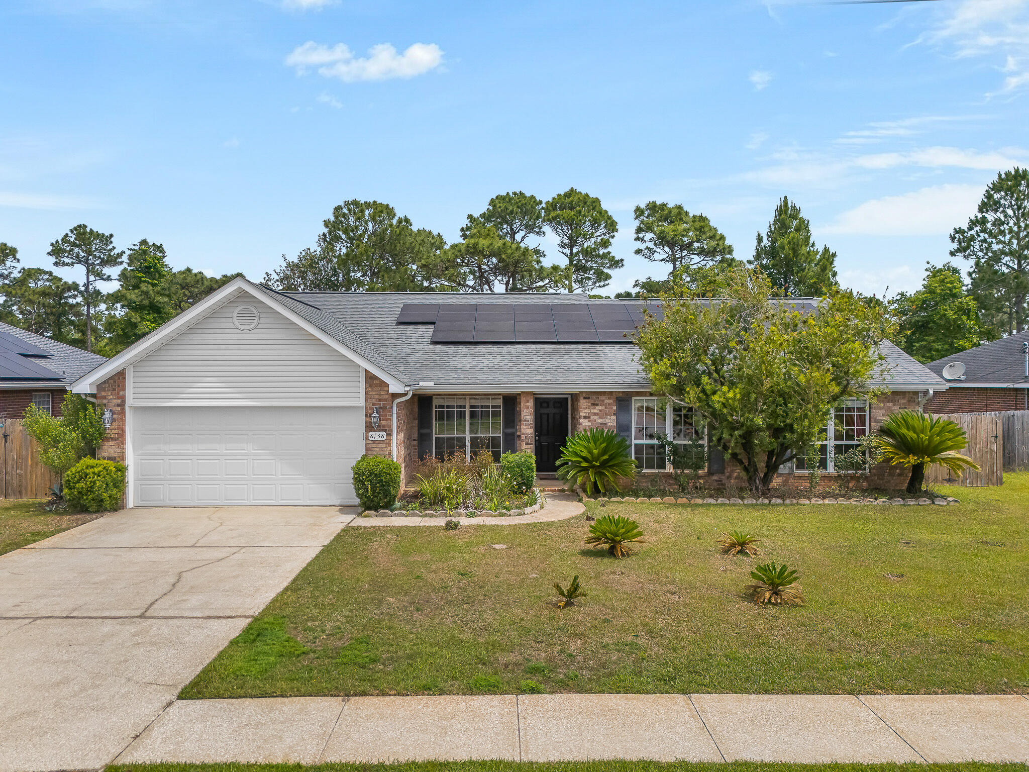 PRICE REDUCED!  

Welcome to 8138 Cosica Boulevard -- a spacious 4-bedroom, 2-bath single-story home in the established Sky Ridge Estates community of Navarre, Florida. Built in 2006, this 2,102 sq ft residence offers a generous great room, formal dining, and an eat-in kitchen with breakfast bar and walk-in pantry.

The master suite is a true retreat, featuring a raised ceiling, walk-in closet, double vanity, and tile finishes. The newly installed shower (2023) provides a fresh, modern feel -- and you'll enjoy the benefits of a therapeutic Kohler walk-in soaking tub offering hydrotherapy massage, safety-focused accessibility, and a luxurious at-home wellness experience.

Three additional bedrooms provide flexibility for family, guests, or a home office. Recent improvements include solar panels (2022) for significant energy savings, HVAC system (approximately 2021), a water heater (approximately 2022), and roof (2016).

The two-car attached garage adds convenience and storage. Located just minutes from Navarre Beach, top-rated schools, shopping, dining, and area military bases, including Hurlburt Field and NAS Pensacola.

Schedule your private showing today.