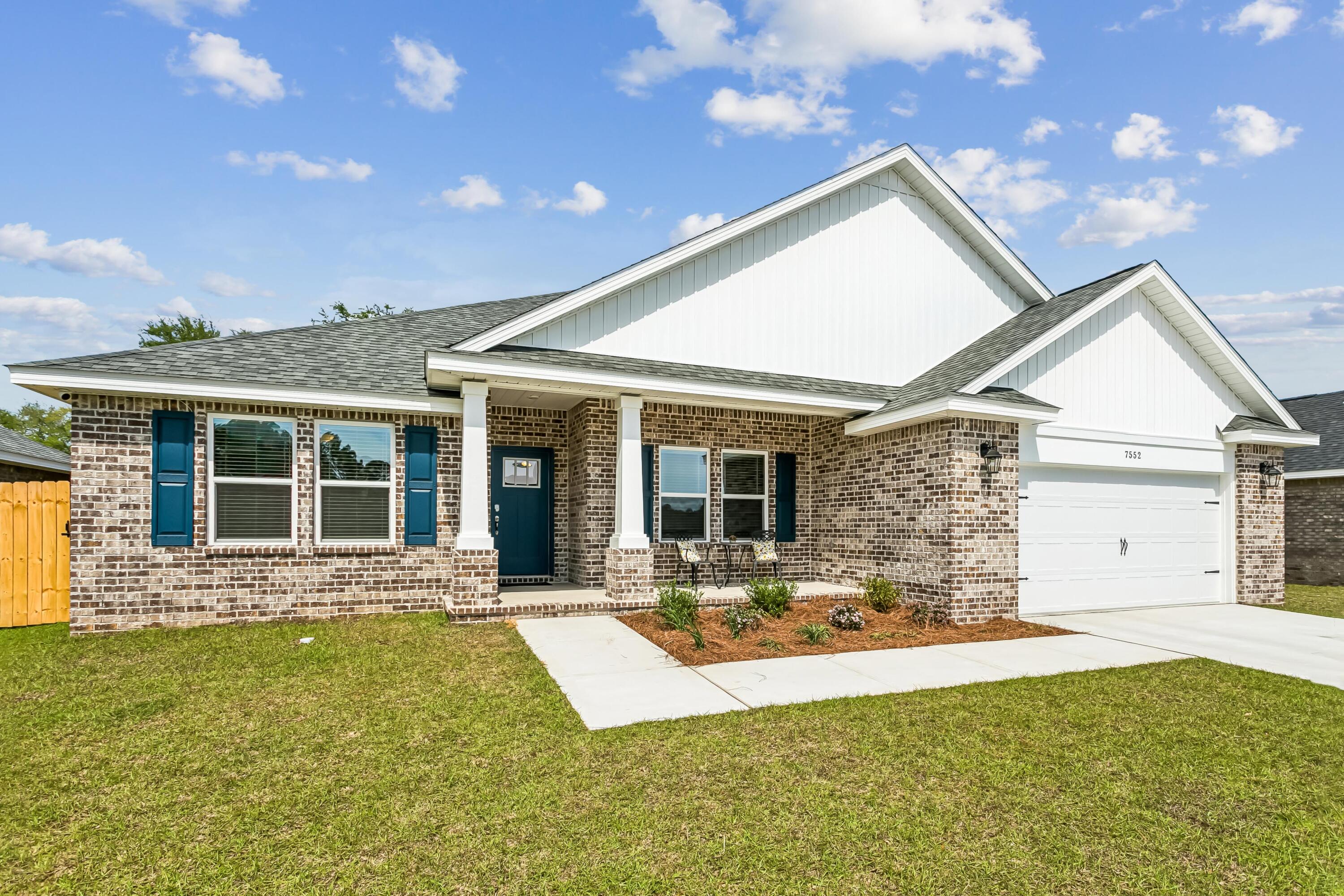 The Turquoise is a beautifully designed 5-bedroom, 3-bath brick home offering a spacious open-concept layout ideal for both everyday living and entertaining. The kitchen includes stainless steel appliances, granite or quartz countertops, under-cabinet lighting, and generous cabinet space, all opening into the great room.
Elegant crown molding enhances the main living areas, and a whole-house 2'' faux wood blind package is included throughout for added privacy and convenience. The luxurious primary suite features tray ceilings, dual walk-in closets, a garden tub, and a tiled walk-in shower with dual showerheads. A private guest suite with its own full bath provides added comfort for family and visitors.
Buckeyes Landing is ideally situated in the heart of Holley-Navarre. The neighborhood is located off Bob Tolbert Road, providing convenient access to major routes including US-98 and State Road 87 for easy commuting east toward Destin or west toward Pensacola. Just minutes from local amenities - including shopping, restaurants, parks, highly rated schools, and world class beaches. 
Projected completion is October 2026.