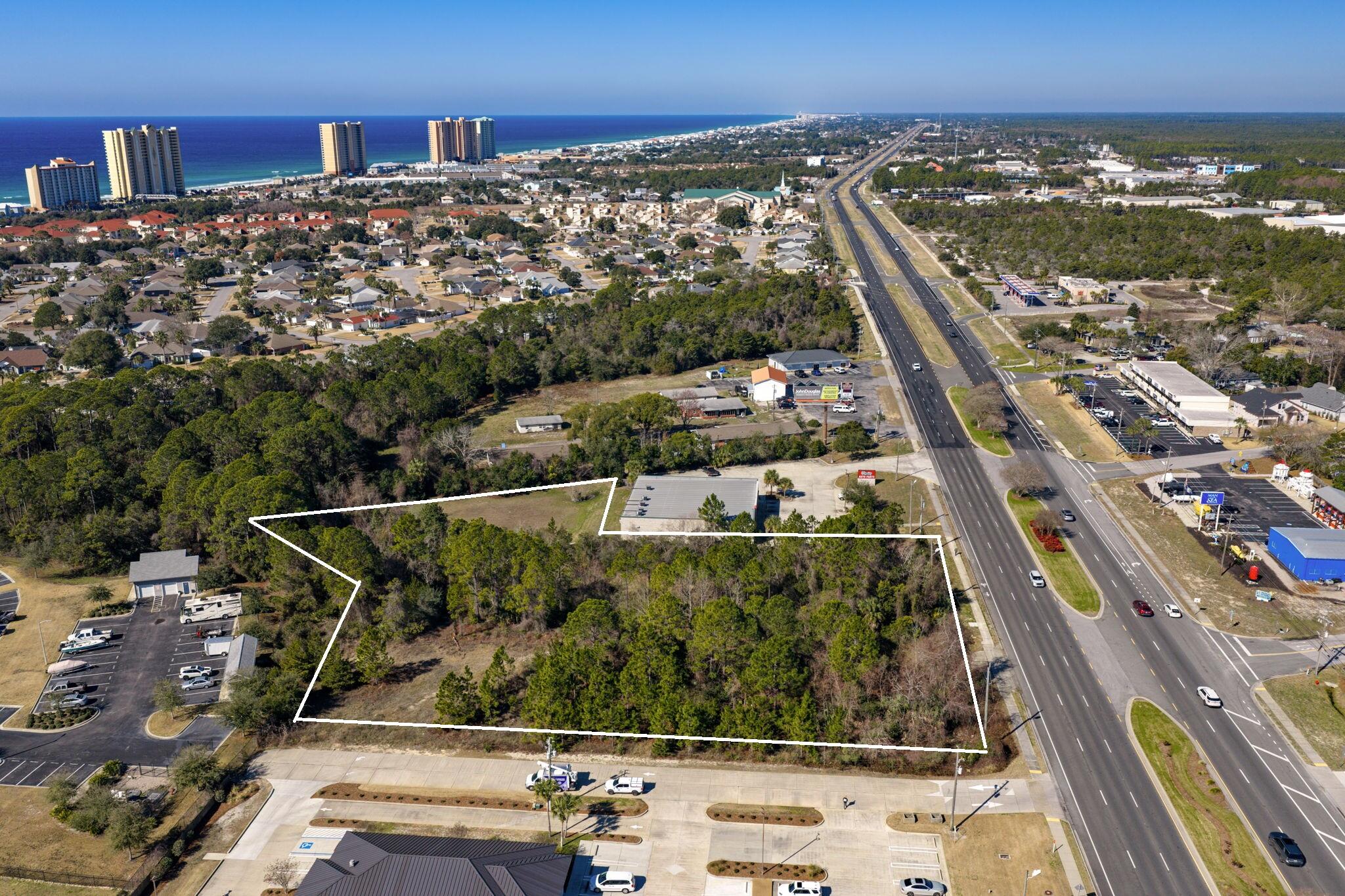 Positioned along the high‑visibility corridor of Panama City Beach Parkway, this 2.74‑acre parcel offers exceptional exposure with a daily traffic count of approximately 47,000 vehicles. The property sits amid a thriving mix of national retailers, local businesses, restaurants, and service providers, making it an ideal location for commercial development. Full access with a median cut enhances convenience and connectivity, allowing smooth ingress and egress for future customers or tenants. With its strong surrounding growth, strategic frontage, and rare accessibility, this site presents a prime opportunity in one of the area's most active commercial corridors.