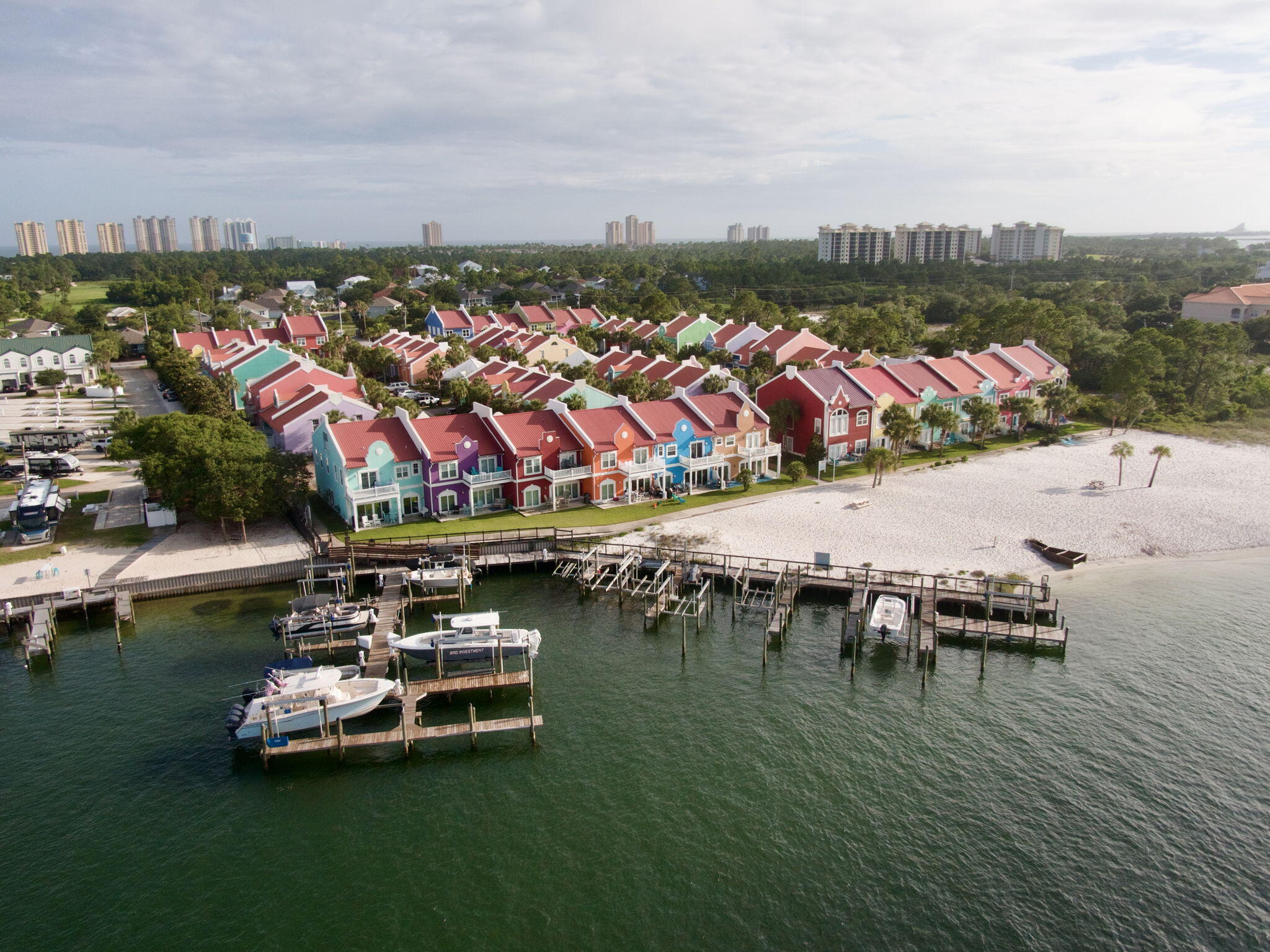Wanting your closing cost paid for??? Well look no further! YOUR TROPICAL PARADISE AWAITS! Driving over the bridge to Perdido Key, the first thing you will see are the brightly-colored townhomes of Banana Bay! You'll feel as if you've been swept away to one of the Dutch Caribbean islands, like Aruba or Curacao, when you drive into the gated community. Whether you're looking for a primary residence, second home, or investment property, this townhome offers the perfect blend of coastal living and resort-style amenities and it comes FULLY FURNISHED!
One of the standout features of Banana Bay is its PRIVATE beach on the Intracoastal Waterway. Residents enjoy direct access to a sandy waterfront area that's perfect for relaxing, paddle boarding, kayaking, fishing, or watching some of the most beautiful sunsets on the Gulf Coast. 
For peace of mind this town home was built with ICF construction. Inside, you'll find a spacious floor plan with almost 1900 SQft. The open living and dining areas make entertaining easy, while the generous bedrooms provide comfort for family and guests alike. Plus a HUGE BONUS room upstairs that makes for an amazing game room/ extra bedroom! 
Banana Bay offers an impressive list of amenities including a community pool, sauna, fitness center, clubhouse, marina, and private beach access.You also have the Lost Key Golf course directly across the street from you!  The community is also conveniently located just minutes from Johnson Beach, Big Lagoon State  Park, NAS Pensacola, waterfront restaurants, and the sugar-white sands that make Perdido Key one of Florida's best-kept secrets.
Whether you're spending your days boating, fishing, enjoying the beach, Golfing or simply relaxing by the water, this home puts you in the center of everything that makes coastal living so special.
Don't miss this one! Reach out now to schedule your personal showing and check out the Video of this unit by searching the address on youtube!