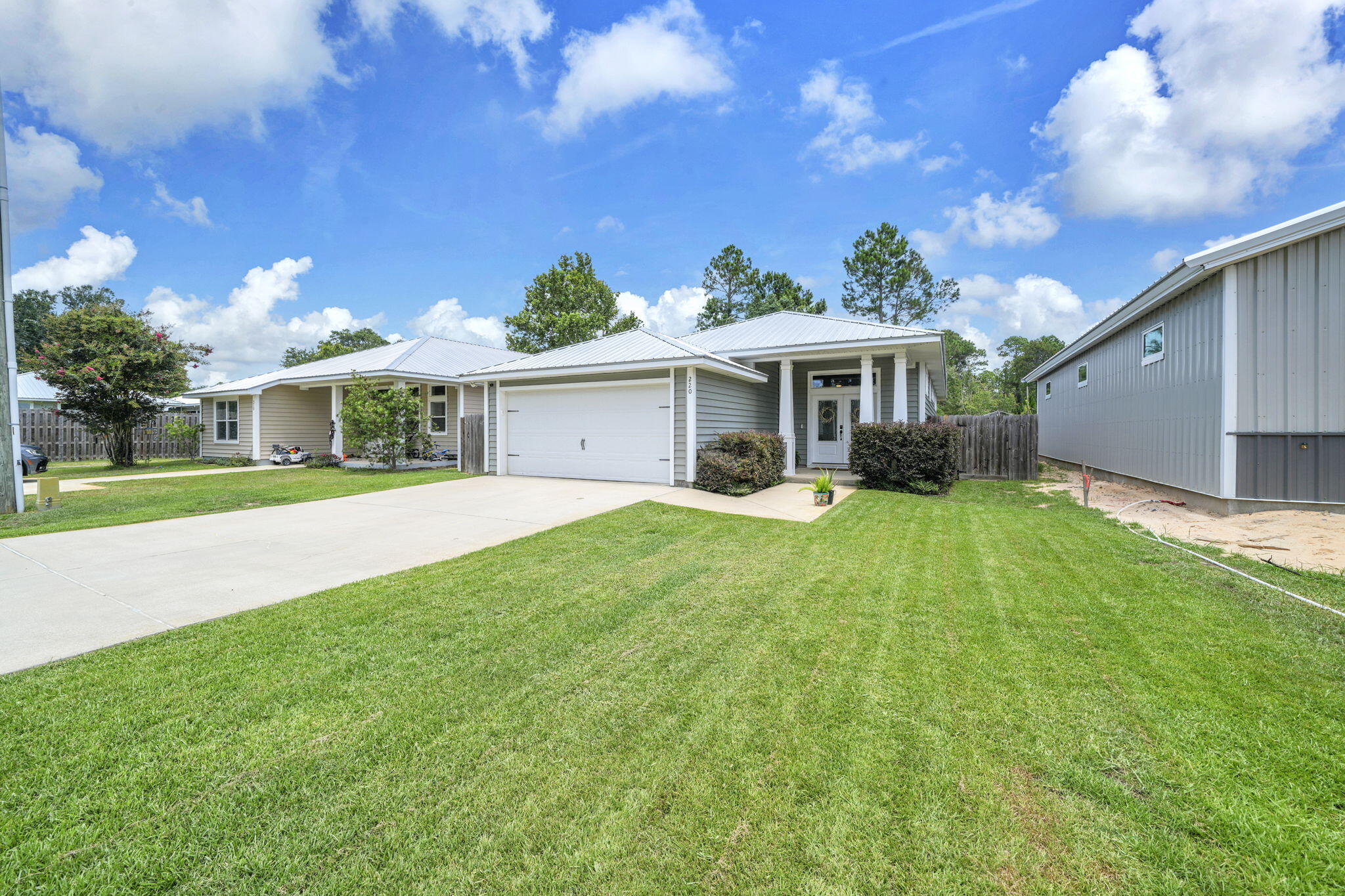 Welcome home to this stunning 3-bedroom, 2-bath residence offering over 1,700 square feet of thoughtfully designed living space with soaring 10-foot ceilings that create an open and inviting atmosphere. The stylish interior features premium luxury vinyl plank flooring throughout, with tile in both bathrooms, and a gorgeous kitchen showcasing granite countertops, butcher block accents, custom pantry barn door, and quality finishes.  The spacious master suite is designed for comfort and features a walk-in closet with custom extra shelving along with a luxurious en-suite bath complete with a large tiled walk-in shower and built-in bench seating.  From the dining area to your private screened-in patio, the perfect place to unwind and relax.  Built with energy efficiency in mind, this home includes a radiant barrier roof system, blown-in insulation and solar panels, helping reduce energy costs while keeping you comfortable year-round. With modern finishes, quality construction, and energy-saving features, this move-in-ready home is one you won't want to miss!  NO HOA!
