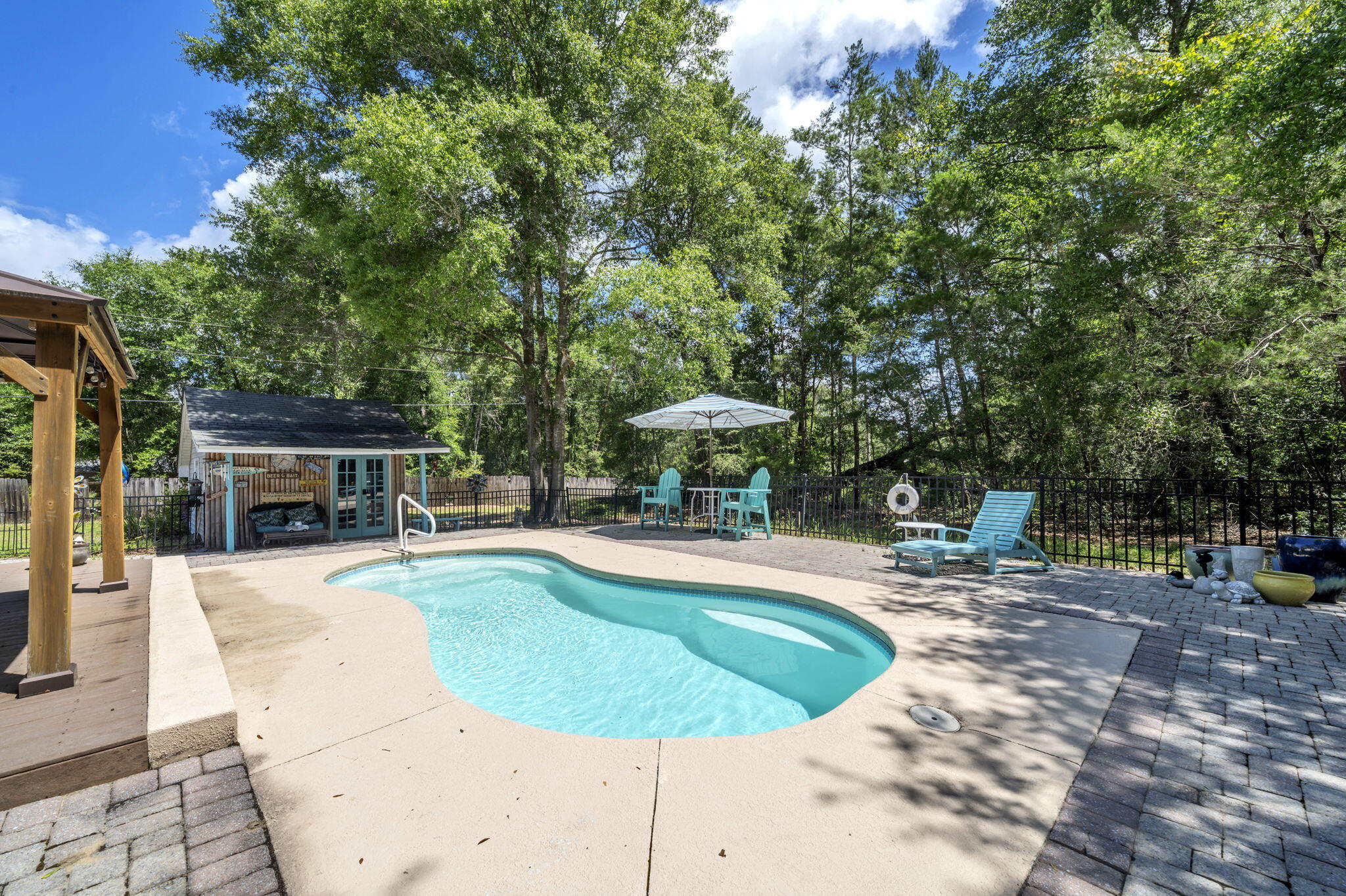 Looking for a little more space and a lot more freedom? This beautifully maintained home sits on approximately 1.33 acres and offers the kind of lifestyle that's becoming harder to find--no HOA, a private pool, workshop with power, room for boats and RVs, and peaceful wooded surroundings.
Inside, you'll find a remodeled kitchen featuring custom cabinetry, farmhouse sink, quartz countertops, stainless appliances, and designer finishes that make everyday living feel special. The spacious living room features vaulted ceilings, abundant natural light, and a beautiful electric fireplace that creates a warm focal point for the space. Thoughtful updates throughout the home create a fresh, move-in-ready feel while maintaining a comfortable and welcoming atmosphere.
Step outside and discover your own private backyard retreat. The sparkling pool, pool house, and expansive patio create the perfect setting for weekend cookouts, family gatherings, football Saturdays, or simply relaxing after a long day. Beyond the backyard, enjoy the peaceful beauty of the pond and mature trees that provide privacy, shade, and a true connection to nature.
Need space for hobbies, projects, or storage? The 12' x 24' workshop with electricity offers endless possibilities. Whether you're storing equipment, working on projects, parking recreational vehicles, or simply enjoying the extra space, this property gives you the flexibility buyers are searching for.
If you've been looking for a Florida pool home with acreage, no HOA restrictions, workshop space, pond views, RV and boat parking, and room to spread out, this property checks all the boxes. Rarely do you find a home that combines privacy, outdoor living, modern updates, and everyday practicality in one package. Come see why this might be the one you've been waiting for.