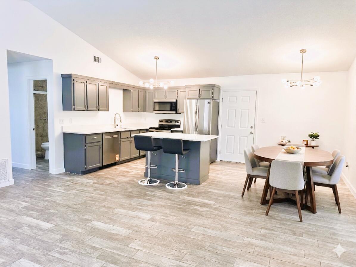 Home 2 BR 2 BA + Garage + Florida Room. Located in the heart of Destin. NO HOA. New Roof 2026, New HVAC 2026, New Water Heater 2026, Copper Wiring, Fresh paint, New sod. Kitchen quartz countertops, stainless steel appliances and farm sink. Wood Burning Fireplace. Single Car Garage and laundry room have new epoxy floors. Bright Florida room has tile flooring and fully enclosed. The backyard is fully fenced in for privacy and low maintenance paver hardscaping. You can access Dewey Destin Park from your backyard (tennis courts, basketball, playground). Seller offering 1 year home warranty & yard maintenance. Home is sold unfurnished. Some photos include virtual staging for illustrative purposes to showcase best use of space and creativity.