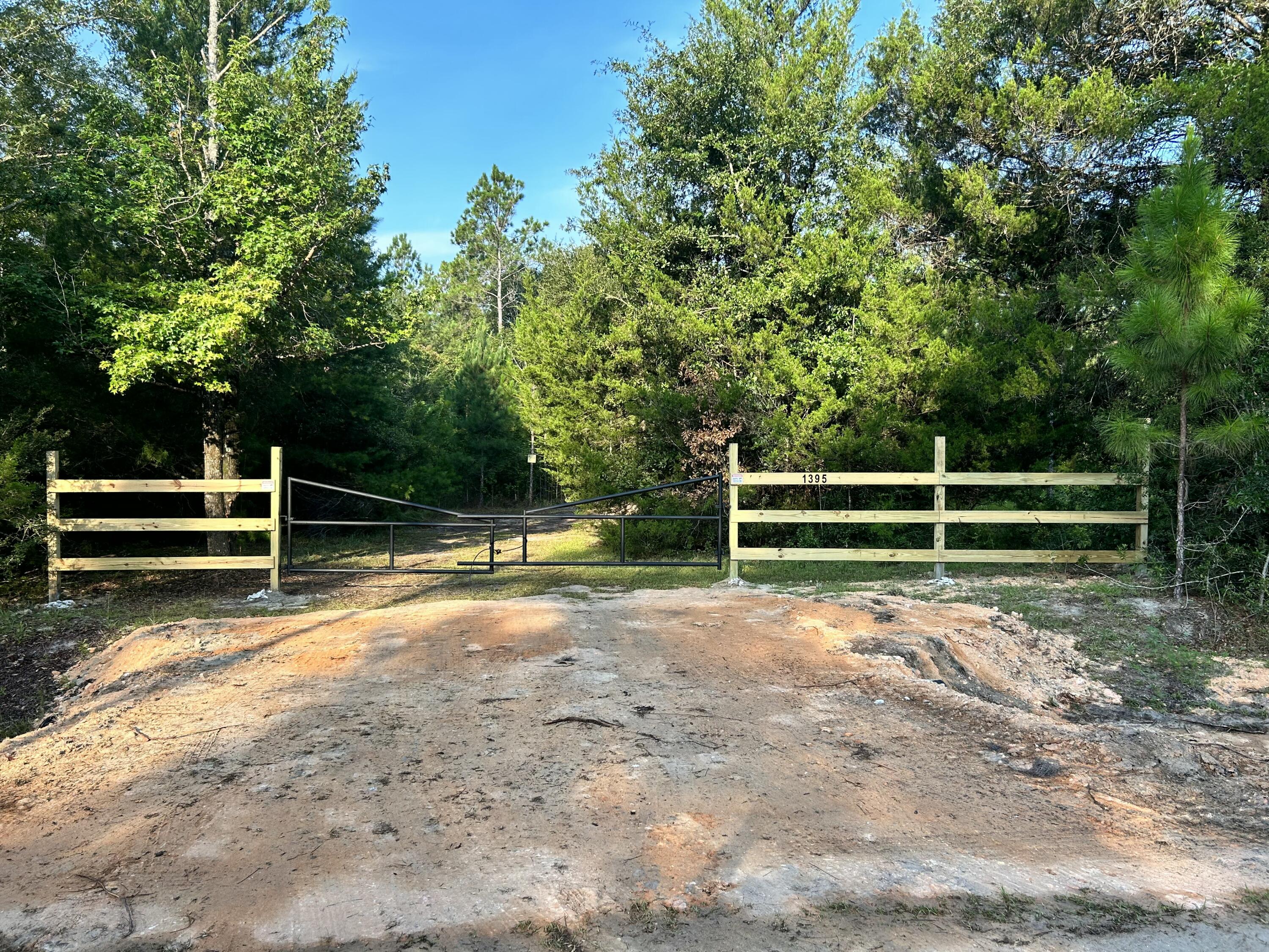 Welcome to 8 acres with a great starter Cabin to call it home!  This property is gated and private.  Once through the gate you will find a cabin with electricity,  a small sustainable bathroom, living and kitchen area.  The property also has a 30 & 50 amp hookup for RV or Camper.  A perfect set up to escape hurricanes, create a hunting camp or live while planning your dream house. There are food plots in place, excellent deer and turkey hunting.  Location is minutes away from Morrison and Ponce De Leon Springs.  The Gulf of American beaches are about 40 minutes away.  The property does not have a well, septic or water.  Schools for this property will be Vernon.