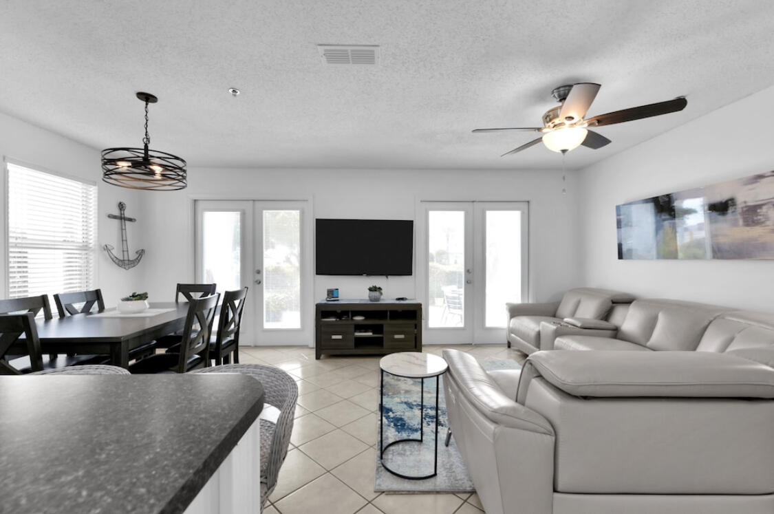 Don't miss this opportunity to own a beautifully updated 2-bedroom + bunk condo in Grand Caribbean at Crystal Beach, just steps from public beach access and the sugar-white sands of the Emerald Coast. This ground-floor corner unit offers unmatched convenience with easy, no-stairs entry--ideal for seamless everyday living, unloading beach gear, and quick trips in and out.

Inside, you'll find a bright, open floor plan with modern furnishings, creating a relaxed coastal feel perfect for full-time living, a second home, or a vacation rental. The spacious owner's suite features a king bed and private bath, while the guest bedroom offers two queen beds. Built-in bunks provide additional sleeping space, maximizing rental potential and guest comfort.

Enjoy the oversized wrap-around patio-perfect for morning coffee or unwinding after a day at the beach. Additional features include an in-unit washer and dryer and a highly desirable location near shopping, dining, and entertainment in Destin.

If you're looking for low-maintenance beach living with unbeatable accessibility and location, this one checks all the boxes.
