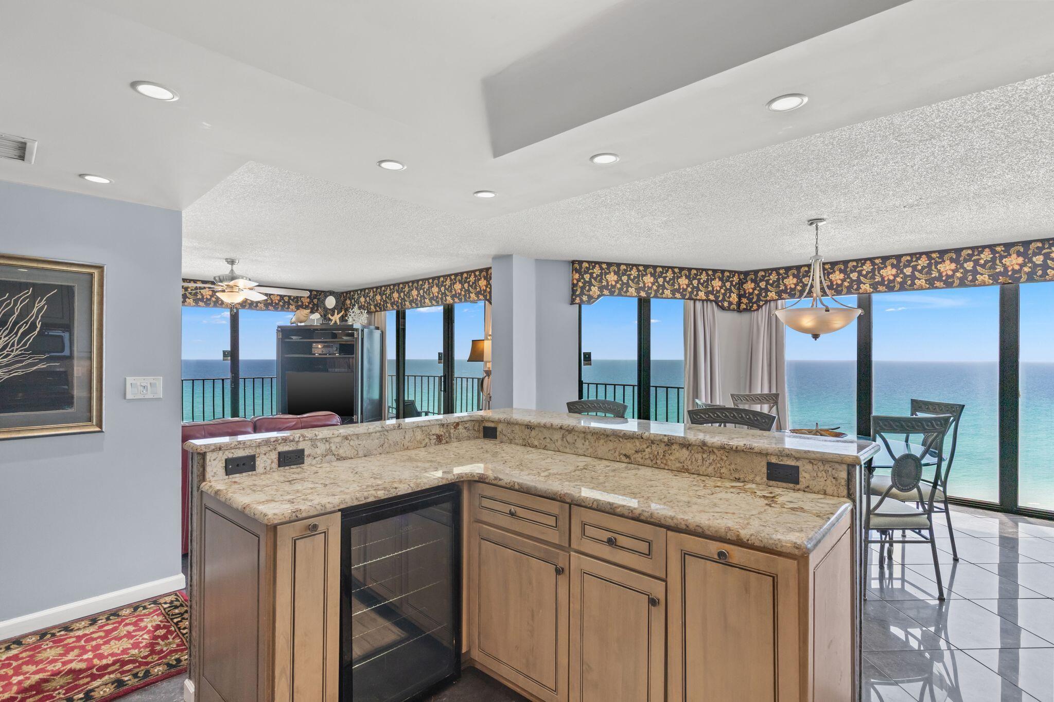 Welcome to Edgewater Tower 2-901, a beautifully updated 3-bedroom, 3-bath beachfront corner residence on the 9th floor of the prestigious Edgewater Beach & Golf Resort Tower II. This highly coveted ''01'' floor plan is perfectly positioned to capture panoramic, unobstructed Gulf views from nearly every room--including the living area, dining space, kitchen, primary ensuite bedroom and guest ensuite bedroom. Step onto the expansive wrap-around balcony and experience what truly sets this residence apart: rare, full east-to-west views of the beach stretching as far as the eye can see. From the east side of the balcony, take in a unique perspective overlooking the resort's lagoon pool and main Edgewater pool deck, blending sweeping coastal scenery with vibrant resort views. In the evenings, enjoy breathtaking, unobstructed sunset-views over the Gulf. The unit offers balcony access from the primary ensuite bedroom, guest ensuite bedroom, living room and dining room. Located within Panama City Beach's only full-service resort, amenities include an 11,500-square-foot lagoon pool, tennis, pickleball, golf, on-site dining, fitness center, 24/7 gated security, and more. Don't miss this rare opportunity to own a 3/3 beachfront paradise with unmatched east-to-west Gulf views and unforgettable sunsets. *Buyer to verify all measurements if deemed important.