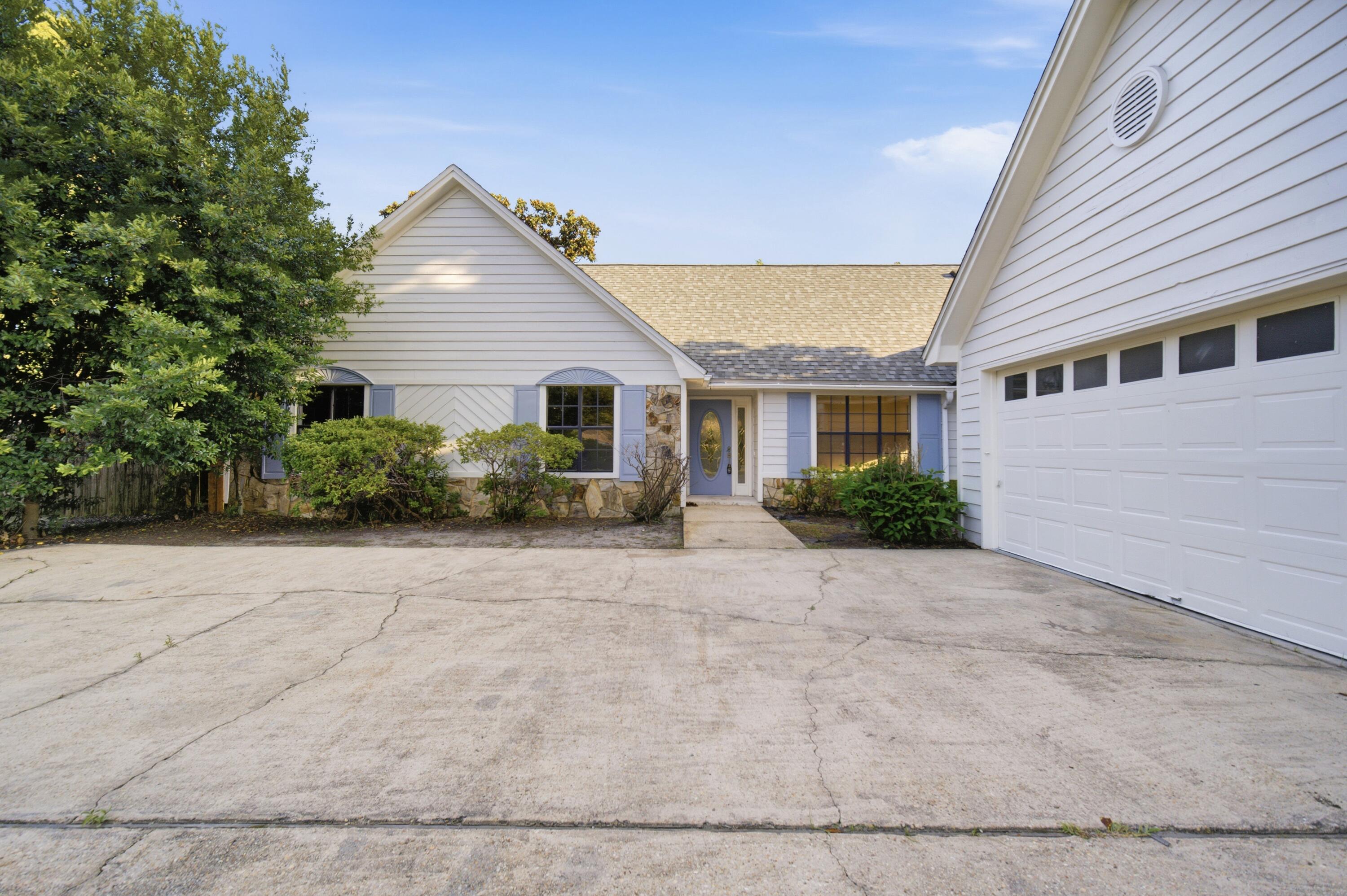 Perfectly situated in the heart of West Destin, this updated 4-bedroom, 3-bathroom home offers the ultimate coastal lifestyle . The freshly painted interior features new flooring and soaring cathedral ceilings that create a bright, open feel. At the center of the home, a large brick fireplace flows seamlessly into the kitchen, which comes fully equipped with granite countertops and stainless steel appliances. Right off the kitchen, the dedicated dining room serves as the perfect family gathering space. The primary suite offers a nice-sized bathroom, a walk-in closet, and its own private access door to the backyard. Upstairs, you will find a massive bonus room and bathroom, along with an additional space overlooking the living room, perfect for a home office or study. This house has it all and features an oversized 2-car garage and a covered outdoor patio perfect spot to have a cookout or soak up the amazing Florida weather. The standout feature of this property is its massive backyard. This expansive lot offers endless potential, with more than enough room for a new pool, a garden, or secure, fenced-in boat storage. Location is everything, and this home places you under a 5-minute drive to the Joe's Bayou boat ramp and Publix, also incredibly close to Destin Elementary School. Additionally, enjoy a convenient commute to all local military bases and a quick 30-minute drive to the VPS airport. Buyer to verify all dimensions.