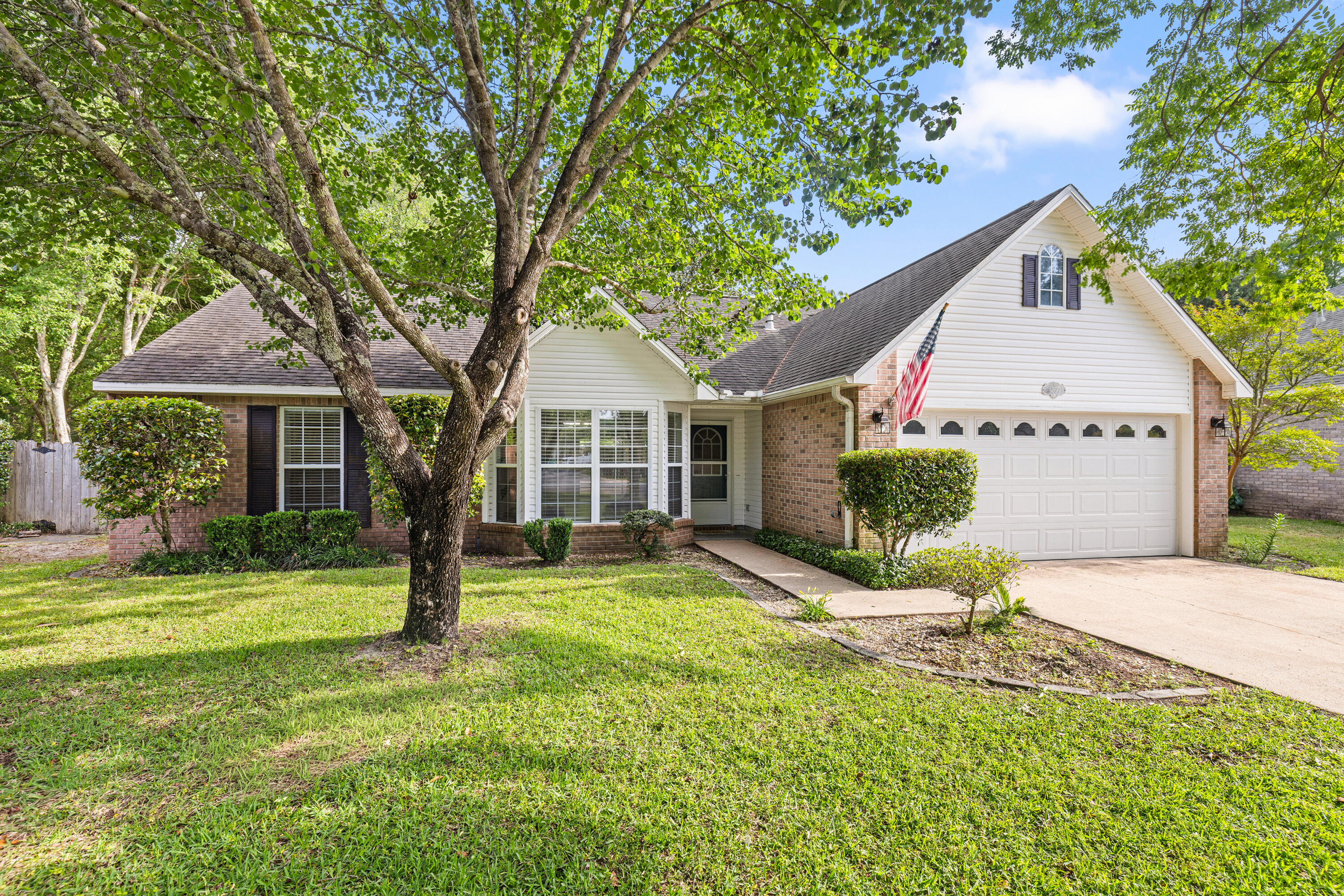 Welcome to this beautiful 4BR/3BA home tucked away on a quiet cul-de-sac in the gated community of Parkwood Estates. Inside, brand new LVP flooring and fresh neutral paint create a bright, updated feel from the moment you walk in. The split bedroom layout provides both privacy and functionality, while the spacious living areas are ideal for everyday living.  The kitchen flows seamlessly into the main living area and features a bright breakfast nook overlooking the backyard.  Master bedroom is conveniently located on the first floor, along with an additional bedroom and full bath.  A separate dining room and spacious living area, highlighted by corner gas fireplace, offer an inviting space for gathering and entertaining. Upstairs features two additonal bedrooms, a full bath, and a versatile landing area, perfect for a home office, study nook, play area or cozy sitting space.  Enjoy added privacy with reservation land bordering the side of the property. The spacious backyard is designed for outdoor enjoyment, featuring a large deck with pergola, string lighting, and a dedicated fire pit area, perfect for relaxing evenings or gathering with friends and family.  There's also plenty of space to add a pool, garden, or expanded living area. New Roof 2026, updated electrical panel 2026 and a 2016 HVAC and Water heater.  Ideally located within walking distance to Bluewater Bay Elementary School and just around the corner from a neighborhood park, plus convenient to shopping, dining, Destin's beautiful beaches and local amenities. Enjoy access to Eglin AFB, Duke Field, and Hurlbert Field. An exceptional opportunity to own in one of Niceville's most desirable gated communities.