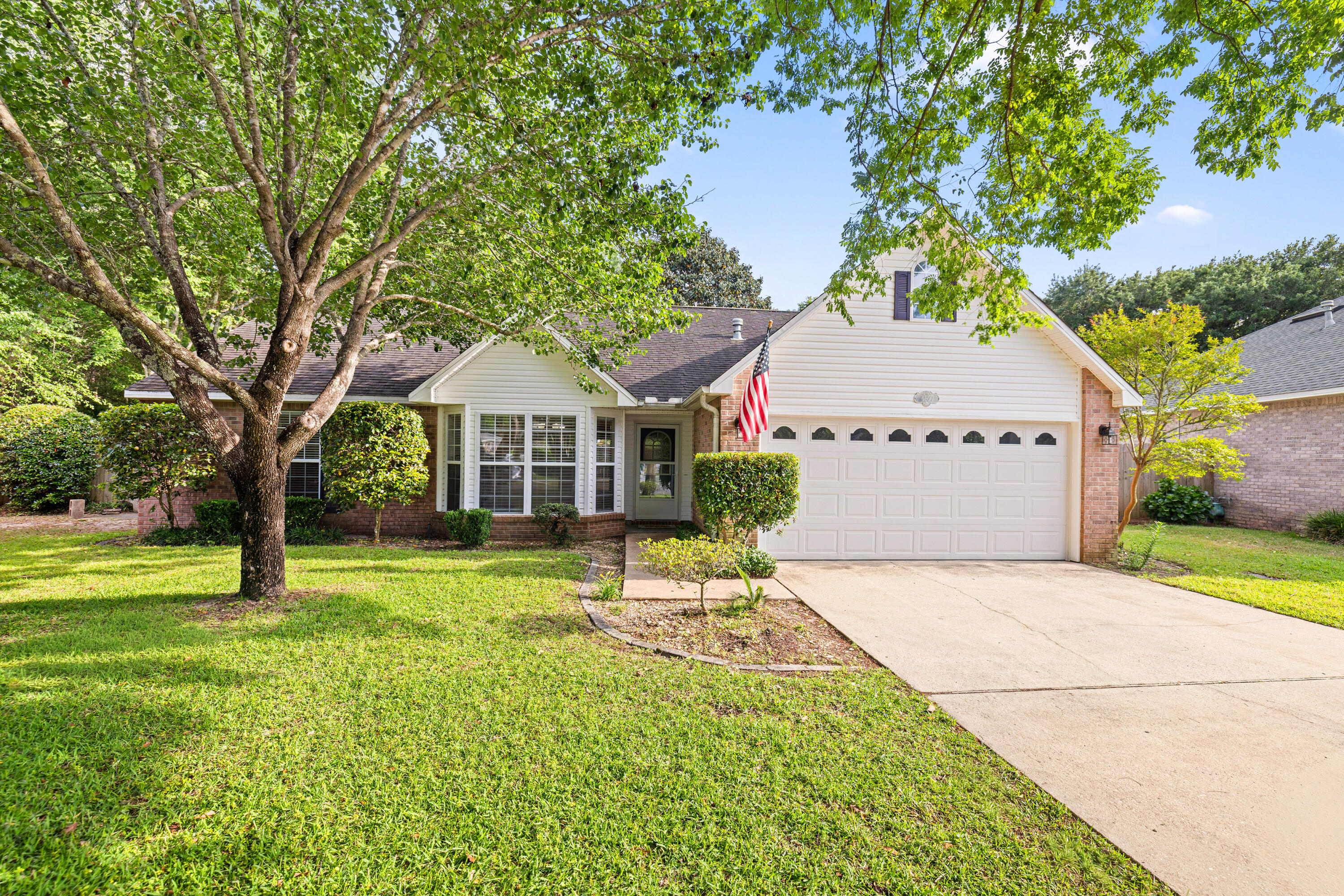 New roof!!! Welcome to this beautiful 4BR/3BA home tucked away on a quiet cul-de-sac in the gated community of Parkwood Estates. Inside, brand new LVP flooring and fresh neutral paint create a bright, updated feel from the moment you walk in. The split bedroom layout provides both privacy and functionality, while the spacious living areas are ideal for everyday living.  The kitchen flows seamlessly into the main living area and features a bright breakfast nook overlooking the backyard.  Master bedroom is conveniently located on the first floor, along with an additional bedroom and full bath.  A separate dining room and spacious living area, highlighted by corner gas fireplace, offer an inviting space for gathering and entertaining. Upstairs features two additonal bedrooms, a full bath, and a versatile landing area, perfect for a home office, study nook, play area or cozy sitting space.  Enjoy added privacy with reservation land bordering the side of the property. The spacious backyard is designed for outdoor enjoyment, featuring a large deck with pergola, string lighting, and a dedicated fire pit area, perfect for relaxing evenings or gathering with friends and family.  There's also plenty of space to add a pool, garden, or expanded living area. New Roof 2026, updated electrical panel 2026 and a 2016 HVAC and Water heater.  Ideally located within walking distance to Bluewater Bay Elementary School and just around the corner from a neighborhood park, plus convenient to shopping, dining, Destin's beautiful beaches and local amenities. Enjoy access to Eglin AFB, Duke Field, and Hurlbert Field. An exceptional opportunity to own in one of Niceville's most desirable gated communities.
