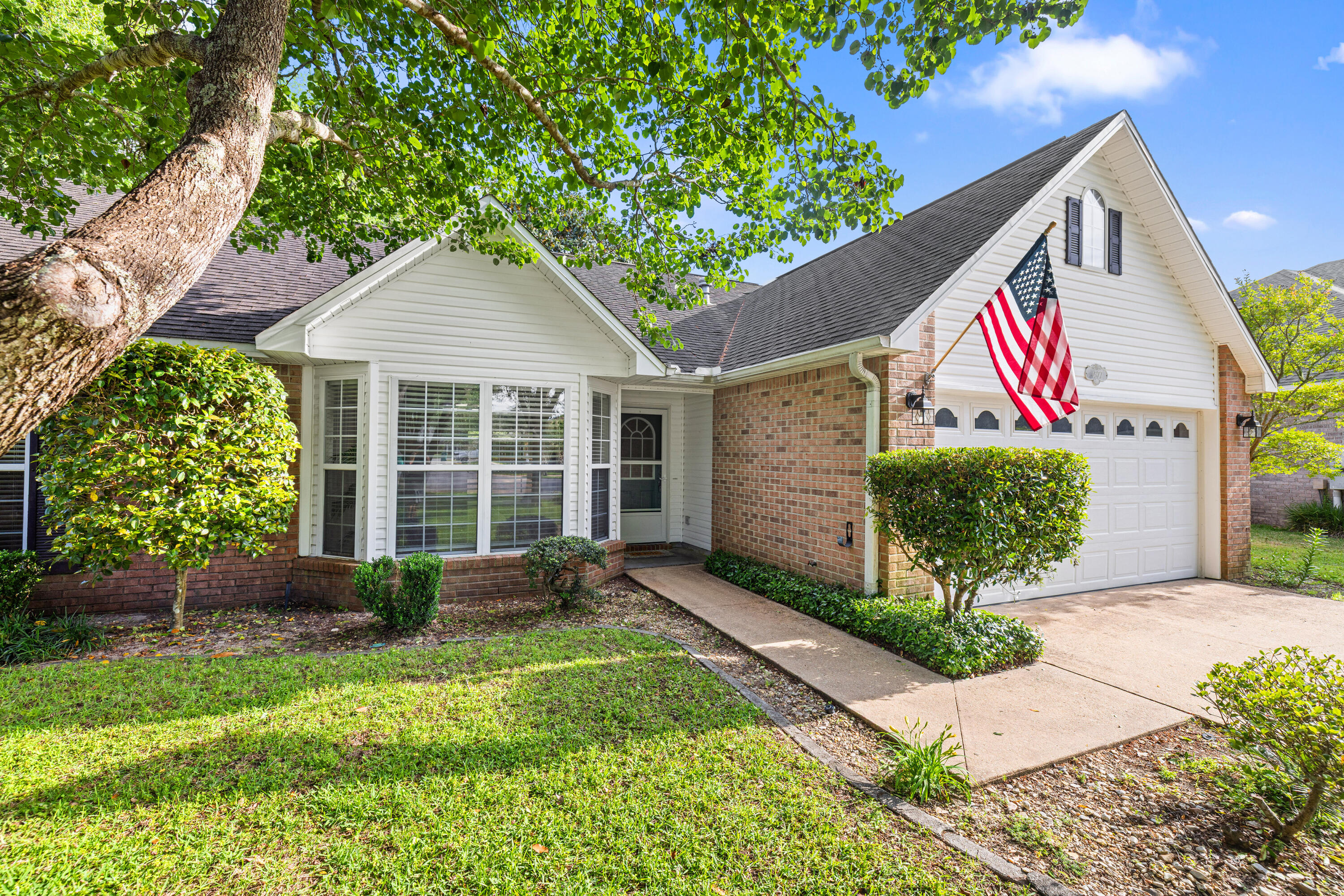 Welcome to this beautiful 4BR/3BA home tucked away on a quiet cul-de-sac in the gated community of Parkwood Estates. Inside, brand new LVP flooring and fresh neutral paint create a bright, updated feel from the moment you walk in. The split bedroom layout provides both privacy and functionality, while the spacious living areas are ideal for everyday living.  The kitchen flows seamlessly into the main living area and features a bright breakfast nook overlooking the backyard.  Master bedroom is conveniently located on the first floor, along with an additional bedroom and full bath.  A separate dining room and spacious living area, highlighted by corner gas fireplace, offer an inviting space for gathering and entertaining. Upstairs features two additonal bedrooms, a full bath, and a versatile landing area, perfect for a home office, study nook, play area or cozy sitting space.  Enjoy added privacy with reservation land bordering the side of the property. The spacious backyard is designed for outdoor enjoyment, featuring a large deck with pergola, string lighting, and a dedicated fire pit area, perfect for relaxing evenings or gathering with friends and family.  There's also plenty of space to add a pool, garden, or expanded living area. New Roof 2026, updated electrical panel 2026 and a 2016 HVAC and Water heater.  Ideally located within walking distance to Bluewater Bay Elementary School and just around the corner from a neighborhood park, plus convenient to shopping, dining, Destin's beautiful beaches and local amenities. Enjoy access to Eglin AFB, Duke Field, and Hurlbert Field. An exceptional opportunity to own in one of Niceville's most desirable gated communities.