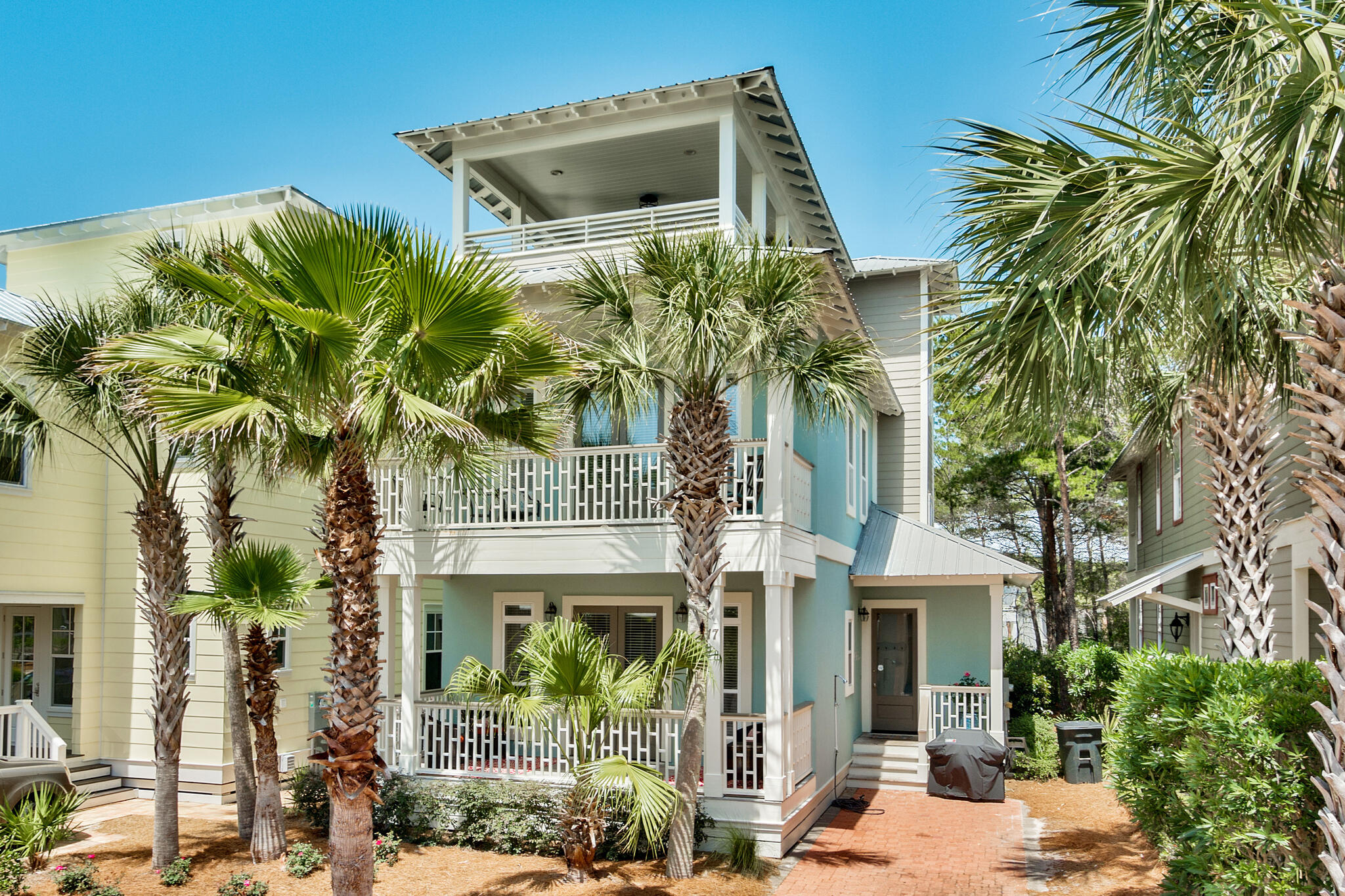 Nestled within the master planned community of Seacrest Beach, this 30A beach house spans three levels and over 2,600 square feet of thoughtfully curated living space. Encompassing a portion of the 800+ square feet of outdoor living space found throughout the residence, the welcoming front porch leads the way to the open living room and dining area. The gourmet kitchen features ample cabinetry, a breakfast bar, and granite countertops. A bedroom suite and screened porch complete the first floor.
Overflowing with natural light, the second level main suite boasts a private outdoor area and a sumptuous ensuite with soaking tub, dual vanities, and a walk-in shower.
