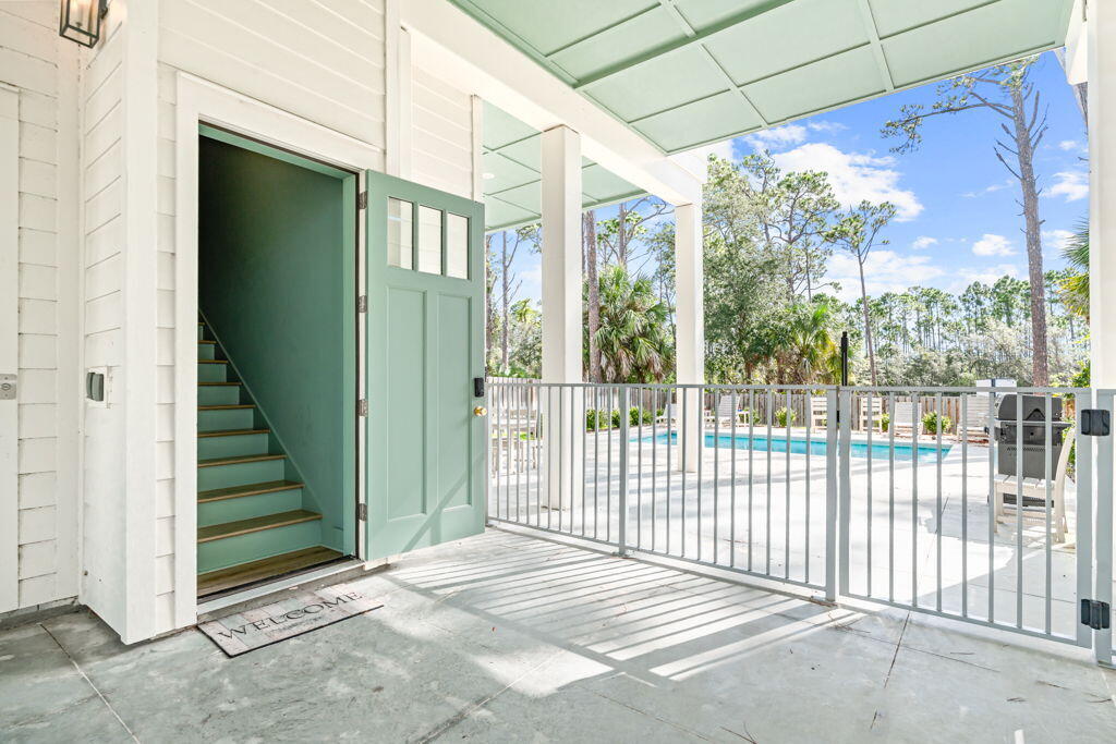 Extremely Motivated Seller! This 5 BR, 4 baths coastal home by Ben Wortman Construction offers over 4,200 sq. ft. of thoughtfully designed living space. Inside, you'll find a gourmet kitchen with stainless steel appliances, a large island, and a wet bar, perfect for entertaining. The vaulted ceilings, open dining area, and covered porch with Gulf views create an inviting atmosphere, while the large laundry room adds convenience for everyday living or extended stays.  Step outside to a fenced backyard with an in-ground pool, or take advantage of your deeded private beach access just moments away. An elevator makes the spacious layout easily accessible. Whether it's a vacation rental, investment property, or personal beach home, this has it all!