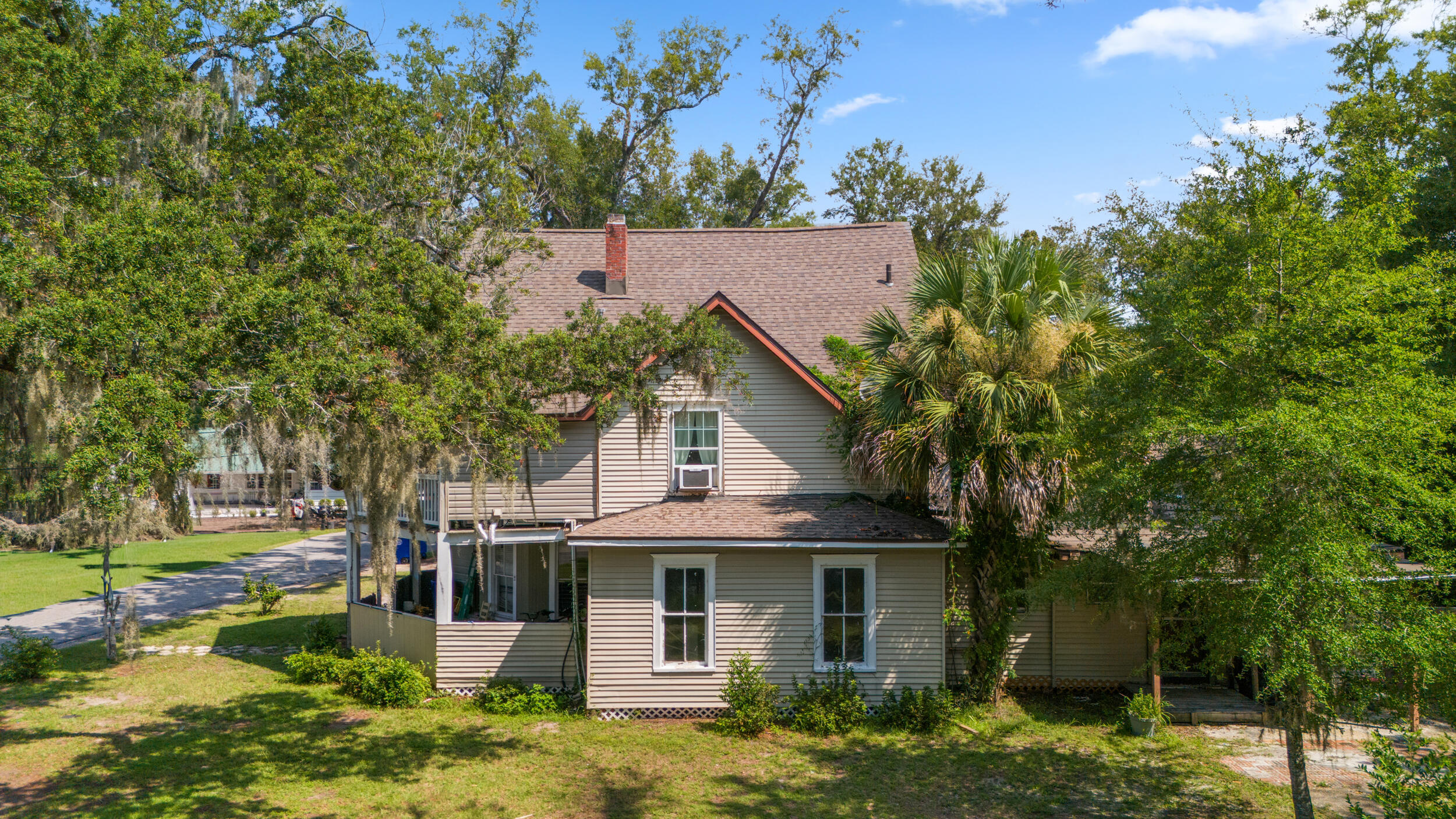 Investor/visionary opportunity in the heart of Panama City. This historic Folk Victorian sits on a quarter-acre corner lot just steps from St. Andrews Bay with second-floor water views. The main home has been taken down to the studs--giving you complete freedom to design, renovate, reconfigure, or build new. No guesswork, just a blank canvas ready for your vision. The property also includes a charming 2-bedroom carriage house already livable, offering immediate rental income or guest space. Surrounded by live oaks and walkable to downtown shops, dining, parks, and events, this is a rare chance to create something truly special while owning a piece of local history.