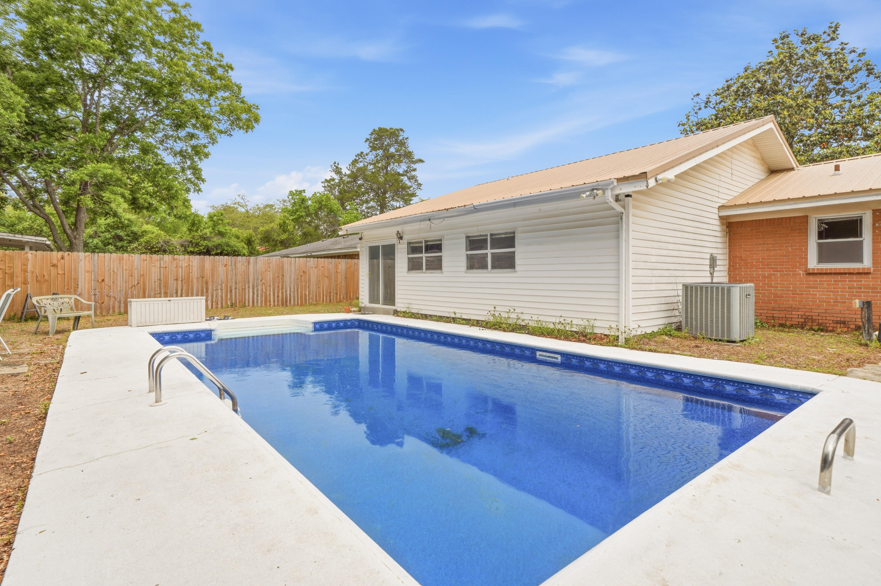 PROFESSIONAL PHOTOS TO COME....
POOL HOME IN THE HEART OF NICEVILLE!! Looking for a home close to public schools, a laundry list of upgrades AND your own private backyard oasis? Come take a look. The owners have added a 450sf living space to the back of the home; added a walk-in tiled shower to what was a master 1/2 bath; updated wiring (2022) and plumbing (2017); installed new privacy fence (2025); replaced roof, HVAC & water heater (2016); all windows (excluding new addition added in 2000) replaced with hurricane-rated windows (2020). new LVP flooring (2026); pool liner replaced (2024); Freshly painted interior (2026). All the heavy lifting is done! Bring your toothbrush and bathing suit~