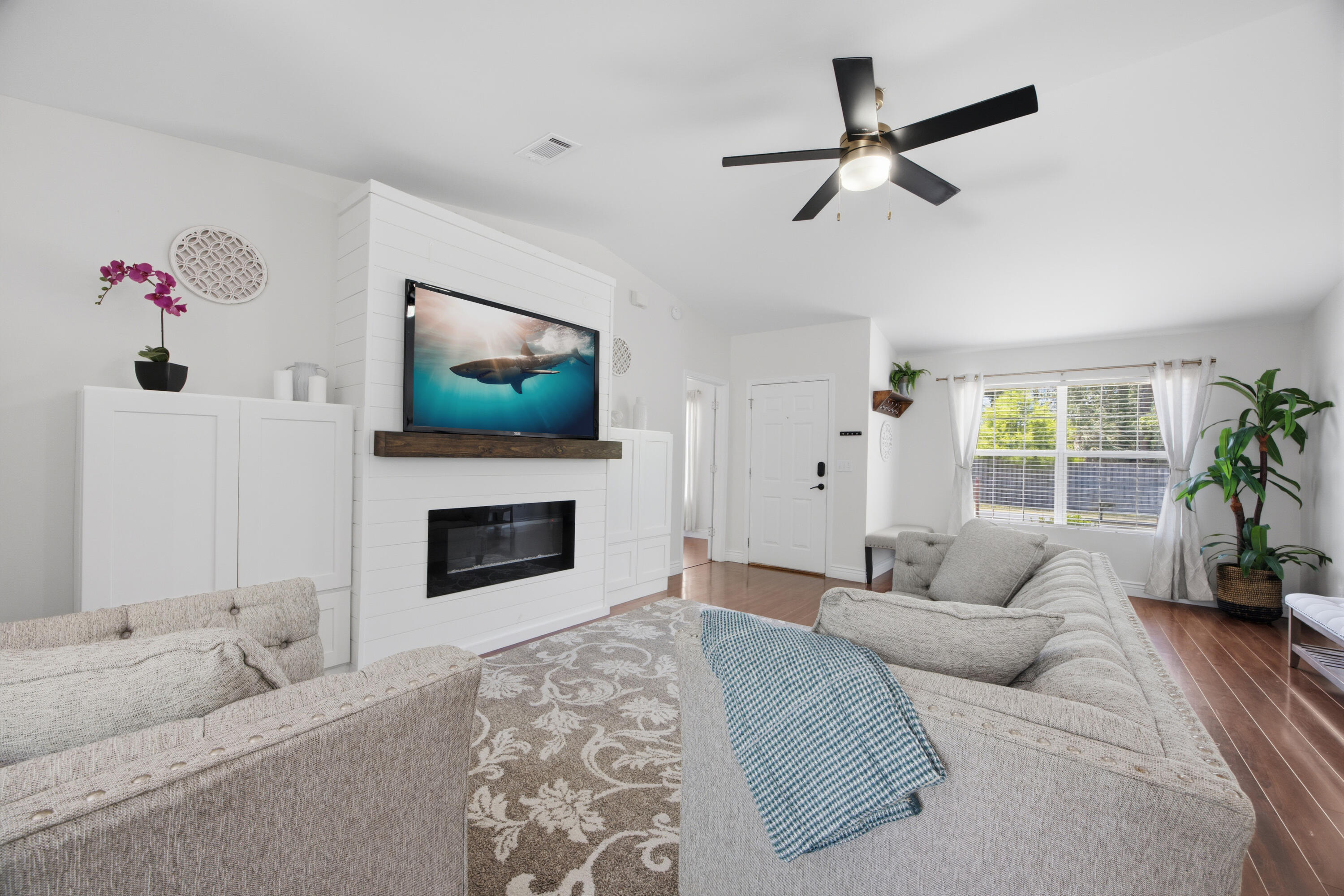 All the upgrades you want at an affordable price. This 3 bedroom, 2 bath home includes a dedicated office space and has already seen major improvements: a new roof (2021), HVAC system (2019), and water heater (2020).
Ideally located near downtown Fort Walton Beach, you'll enjoy convenient access to shopping, dining, and are just minutes from the sugar white beaches of Okaloosa Island and Destin.
Inside, the home features high vaulted ceilings and a striking built-in shiplap accent wall complete with cabinetry and an electric fireplace. A versatile bonus room with its own exterior entrance to the backyard offers endless possibilities, perfect for a home office, playroom, or hobby space. Ceiling fans throughout for added comfort. The kitchen features quartz countertops, stainless steel appliances, a single-basin sink, gold hardware and faucet, and a pantry closet.

Split floor plan with a private primary suite, including a walk-in closet with custom shelving and a bathroom with a stand-alone shower.

Backyard includes a painted deck, privacy fencing, built-in firepit with rock surround, and paved patio areas on both sides of the deck. Double gate with concrete pad offers RV or boat parking.

Presented with staging furniture.