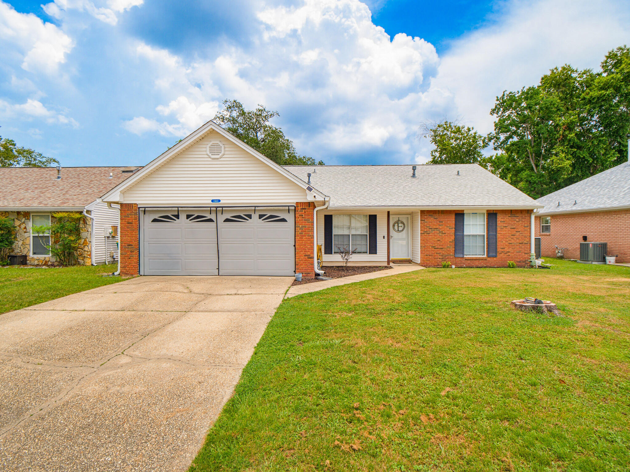 1565 Meadowbrook Ct brings together comfort, convenience, and easygoing Niceville charm. This 3-bedroom, 2-bath home offers 1,511 square feet of thoughtfully arranged living space, anchored by a smart split floor plan that keeps the primary suite private from the secondary bedrooms.

Gather beneath the vaulted ceiling in the family room, where the space feels open and airy. Just beyond, an enclosed Florida room outfitted with storm windows extends your living area year-round--an ideal spot for morning coffee or a quiet afternoon read. Just outside is a fully fenced backyard that offers room to play, garden, or simply unwind in privacy. The upgraded installed covered gutters also add a practical touch of care.

Blue Pine Village sweetens the deal with standout perks: a community pool for warm-weather afternoons and RV/boat storage exclusively for owners--perfect for those who love the water or the open road. Ample driveway parking rounds out the everyday practicality.

Location is a genuine highlight here. Woodlands Park sits less than a mile away, ready for weekend visits and outdoor fun. Publix at The Crossing handles grocery runs, while Rocky Bayou School and the Niceville Community Center are both close by. Commuters will appreciate quick access to Spence Parkway, smoothing the drive toward Destin or Fort Walton Beach. Peaceful surroundings and thoughtful amenities make this Niceville gem a place you'll be proud to call home.
Roof May 2024, AC June 2024, Gas water heater April 2022.Refrigerator 2022, Microwave April 2024, master bathroom  remodeled 2022, Guest bathroom remodeled 2024.Washer/dryer Sepetember 2024 Most of wooden fence 2026. Flood zone X, no flood insurance.